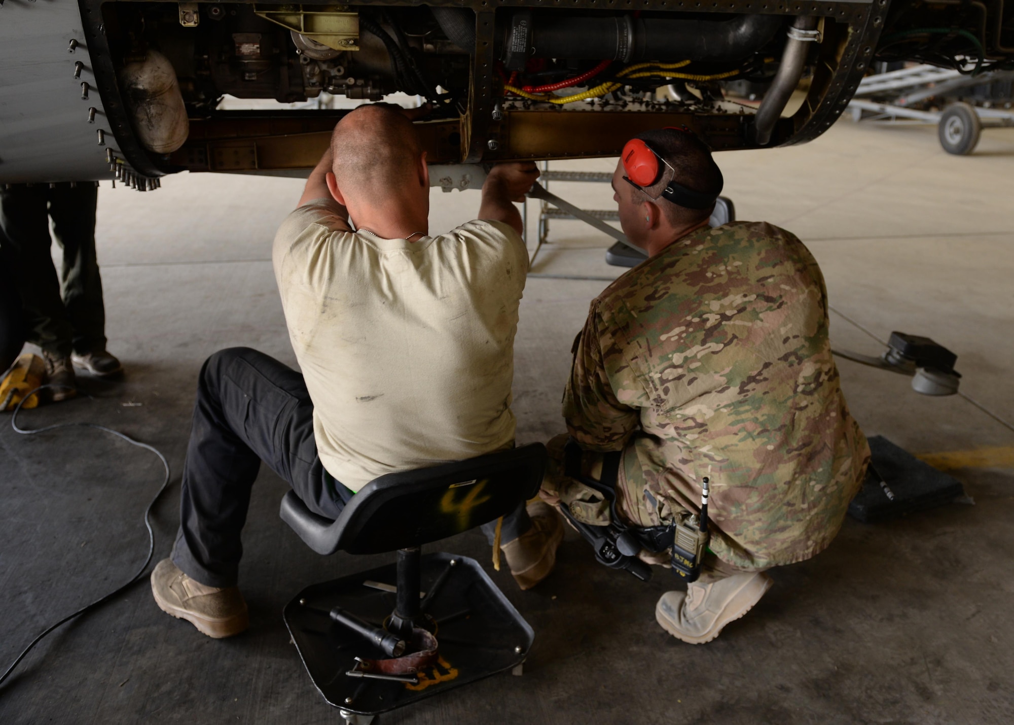 U.S Air Force Staff Sgt. William Hogarth (left) and TSgt. Charles Nichols, 455th Expeditionary Aircraft Maintenance Squadron F-16 aircraft maintainers inspects parts of a jet after taking it apart during a phase inspection July 7, 2015, at Bagram Airfield, Afghanistan. The phase inspection team, who has been deployed to BAF for two months, is working on their 12th phase inspection that occurs after a jet has reached 400 flying hours. (U.S. Air Force photo by Senior Airman Cierra Presentado/Released)