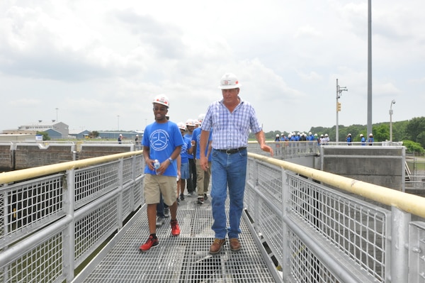 Charlie Bryan, U.S. Army Corps of Engineers Nashville District,lock master talks with a student while crossing the Old Hickory Lock June 24, 2015. The students from Tennessee State University Engineering Department's four-week National Summer Transportation Institute program visited the lock to study engineer and navigation.  