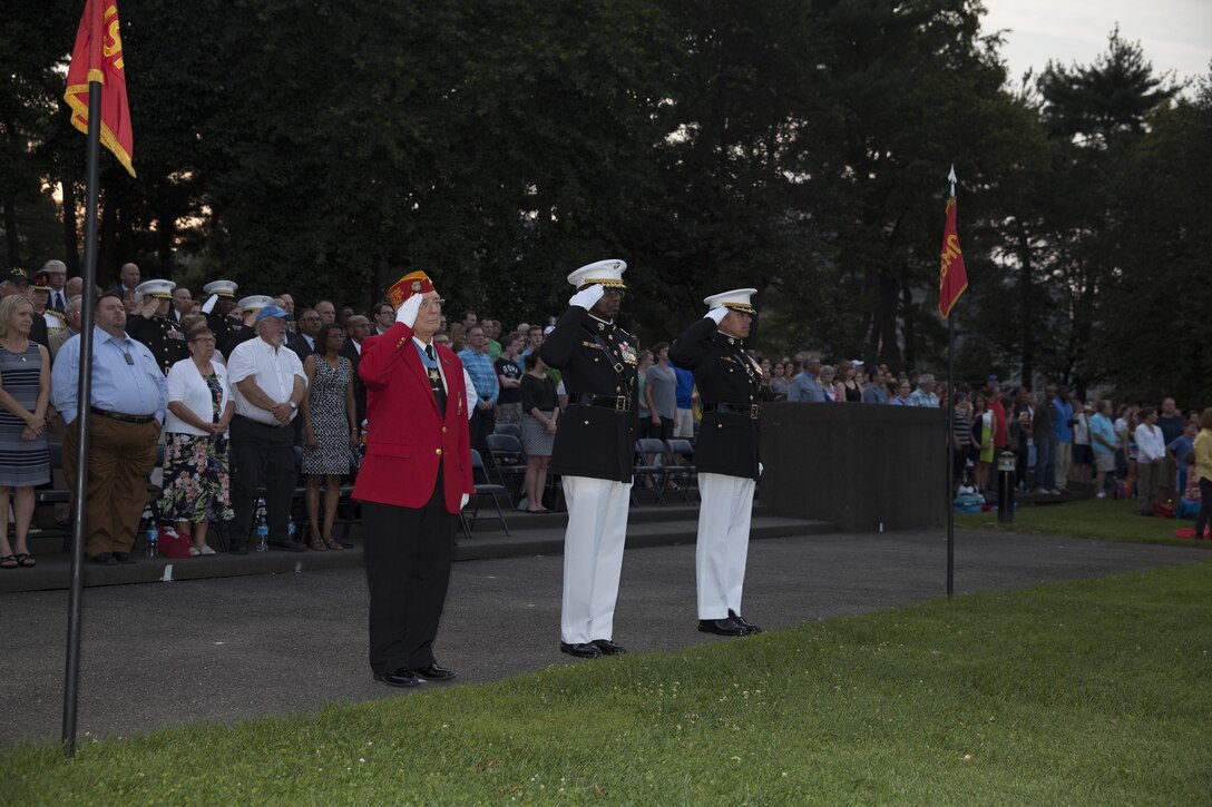 Retired Marine Corps Chief Warrant Officer 4 Hershel “Woody” Williams, Medal of Honor recipient, left, Lt. Gen. Ronald L. Bailey, deputy commandant of Plans, Policies, and Operations, center, and Col. Benjamin T. Watson, commanding officer of Marine Barracks Washington, D.C., right, salute during honors at the Marine Corps War Memorial, Arlington, Va., July 7, 2015. Williams was the guest of honor for the parade, and Bailey was the hosting official. Since September 1956, marching and musical units from Marine Barracks Washington, D.C., have been paying tribute to those whose“uncommon valor was a common virtue” by presenting sunset parades in the shadow of the 32-foot high figures of the United States Marine Corps War Memorial. (U.S. Marine Corps photo by Lance Cpl. Samantha K. Draughon/ Released)
