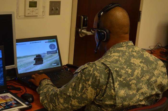 A U.S. Army military policeman conducts training and assessment of Virtual Battle Space 3 in support of joint non-lethal weapons escalation of force scenarios.