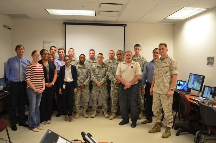 The Simulator Assessment Working Group, based in Orlando, Florida, gathers for the Army Distributed Soldier Training System assessment of joint non-lethal weapons escalation of force scenarios.