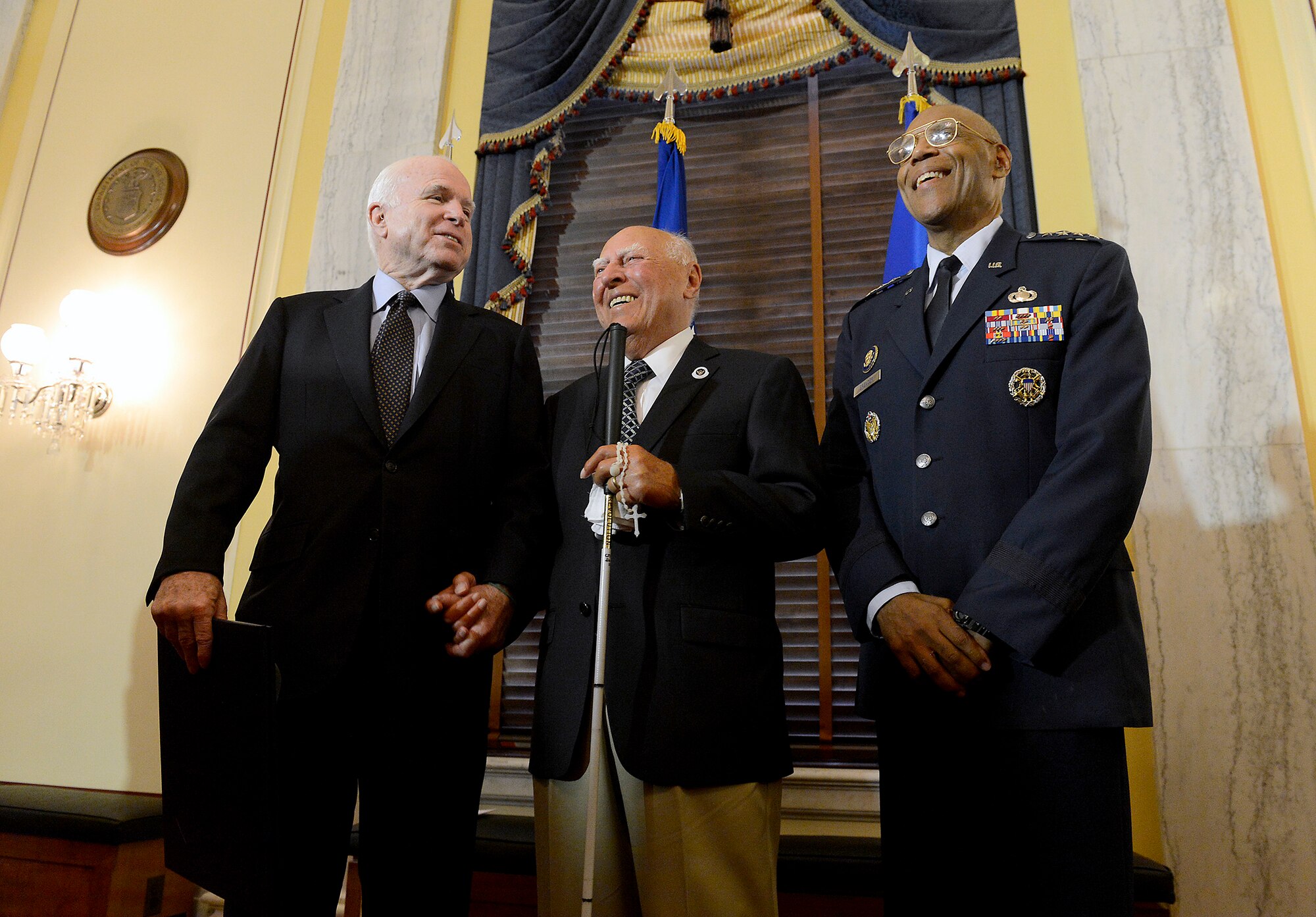 Sen. John McCain and Air Force Vice Chief of Staff Gen. Larry O. Spencer congratulate 2nd Lt. John Pedevillano, a WWII Army Air Corps B-17 bombardier, during a ceremony in his honor, in Washington, D.C., July 7, 2015. McCain and Spencer presented Pedevillano with the Presidential Unit Citation with one oak leaf cluster. He is the last survivor of his WWII unit. (U.S. Air Force photo/Scott M. Ash)