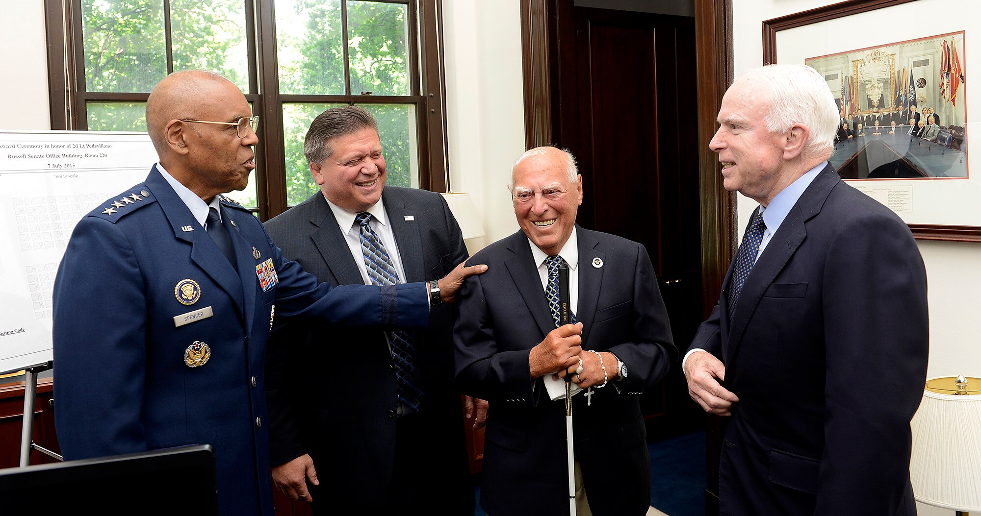 Air Force Vice Chief of Staff Gen. Larry O. Spencer meets with 2nd Lt. John Pedevillano, third from left, a WWII Army Air Corps B-17 bombardier, with his son-in-law William Lucci, and Sen. John McCain, in Washington, D.C., July 7, 2015. Spencer and McCain presented Pedevillano with the Presidential Unit Citation with one oak leaf cluster. He is the last survivor of his WWII unit. (U.S. Air Force photo/Scott M. Ash)