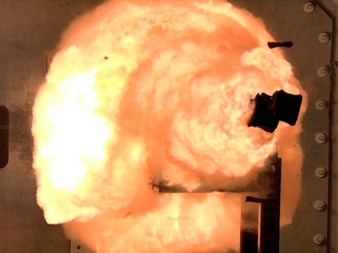 A high-speed camera captures the first full-energy shots from the Office of Naval Research-funded electromagnetic railgun prototype launcher that was recently installed at a test facility in Dahlgren, Va. The test shots begin a month-long series of full-energy tests to evaluate the first of two industry-built launchers that will help bring the Navy a step closer to producing a next-generation, long-range weapon for surface ships. The new launcher brings advanced material and high-power technologies in a system that now resembles a large-caliber gun. 