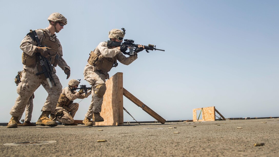 Private First Class Cody Hoag moves to cover during a short-range marksmanship qualification course aboard the dock landing ship USS Rushmore (LSD 47). The 15th Marine Expeditionary Unit is embarked on the Essex Amphibious Ready Group and deployed to maintain regional security in the U.S. 5th Fleet area of operations. Hoag is a machine gunner with Kilo Company, Battalion Landing Team 3rd Battalion, 1st Marine Regiment, 15th MEU.