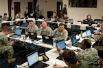 Airmen and Soldiers from the Kentucky National Guard staff a Joint Air Operations Center at the Kentucky Air National Guard Base In Louisville, Ky., on May 17, 2011. The JAOC is supporting a major earthquake-response exercise by prioritizing and allocating air assets for missions into affected areas across the state.