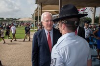 U.S. Sen. John Cornyn speaks with Tech. Sgt. Michael Gibson, 321st Training Squadron military training instructor, after the Air Force Basic Military Training graduation parade July 3 at the parade grounds at Joint Base San Antonio-Lackland. The senator visited JBSA-Lackland to learn about the function and mission of the 37th Training Wing, the largest training wing in the Air Force, and to thank the newest members of the U.S. Air Force for their commitment and service. (U.S. Air Force photo by Johnny Saldivar)