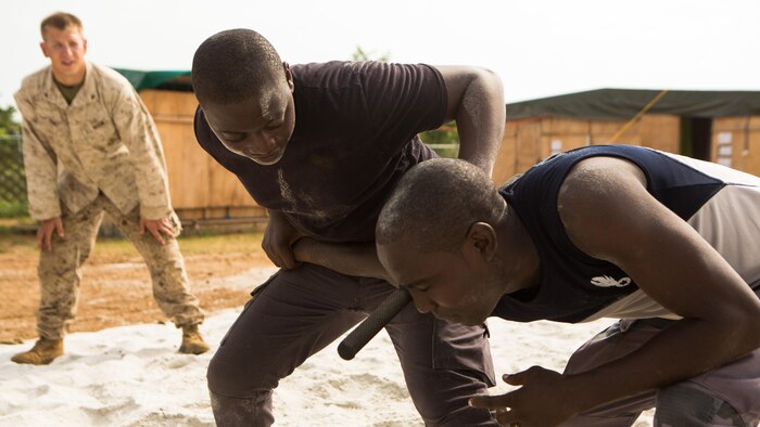 Gabonese Gendarmerie service members practice non-lethal compliance techniques at a Cooperative Security Location established by U.S. Marines with Special-Purpose Marine Air-Ground Task Force Crisis Response-Africa in Libreville, Gabon, June 24, 2015. The Gendarmerie service members first completed a physically challenging circuit course to test their ability to remain calm and put their training to the test under fatigue and stress. The Marines, who are based out of Morón Air Base, Spain, are currently validating their forward-staging capabilities aboard the CSL while building partnerships with their Gabonese counterparts. 