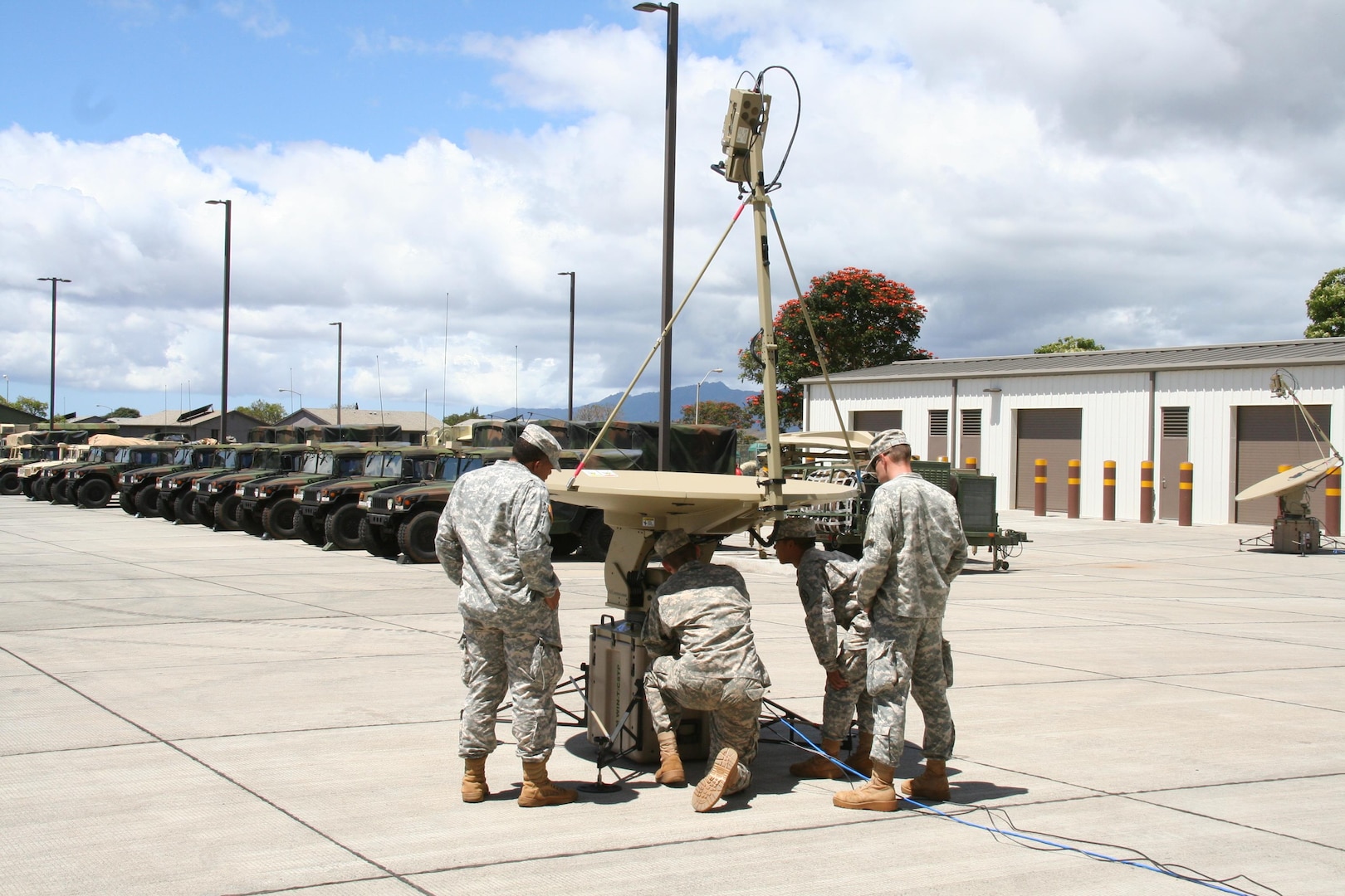 Soldiers from the 307th Expeditionary Signal Battalion (ESB) practice troubleshooting procedures during new equipment training for Secure Internet Protocol Router/Non-secure Internet Protocol Router (SIPR/NIPR) Access Point (SNAP) bridging terminals, at Helemano Military Reservation, Hawaii, in June 2015. The capability provides secure beyond-line-of-sight communications at the company level and below. (U.S. Army photo by Amy Walker, PEO C3T)