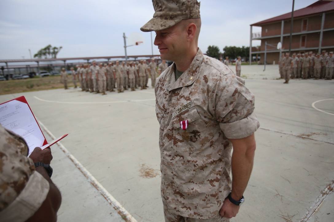 Marines with the 13th Marine Expeditionary Unit are presented with awards and promoted aboard Marine Corps Base Camp Pendleton, Calif., July 1, 2015. While some Marines are awarded for their expertise in their field and creative ideas, while others were promoted receiving even greater responsibilities.(U.S. Marine Corps photo by Lance Cpl. Alvin Pujols/Released) 