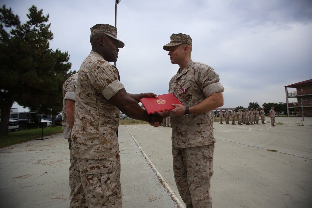 Marines with the 13th Marine Expeditionary Unit are presented with awards and promoted aboard Marine Corps Base Camp Pendleton, Calif., July 1, 2015. While some Marines are awarded for their expertise in their field and creative ideas, while others were promoted receiving even greater responsibilities.(U.S. Marine Corps photo by Lance Cpl. Alvin Pujols/Released) 