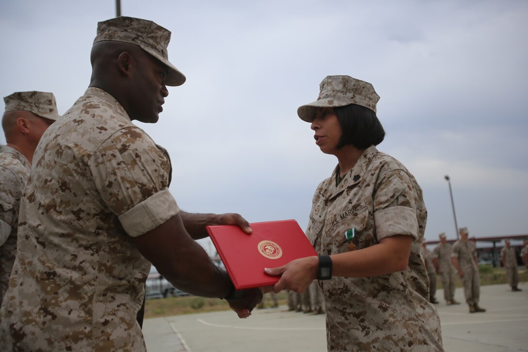 Marines with the 13th Marine Expeditionary Unit are presented with awards and promoted aboard Marine Corps Base Camp Pendleton, Calif., July 1, 2015. While some Marines are awarded for their expertise in their field and creative ideas, while others were promoted receiving even greater responsibilities.(U.S. Marine Corps photo by Lance Cpl. Alvin Pujols/Released) 
