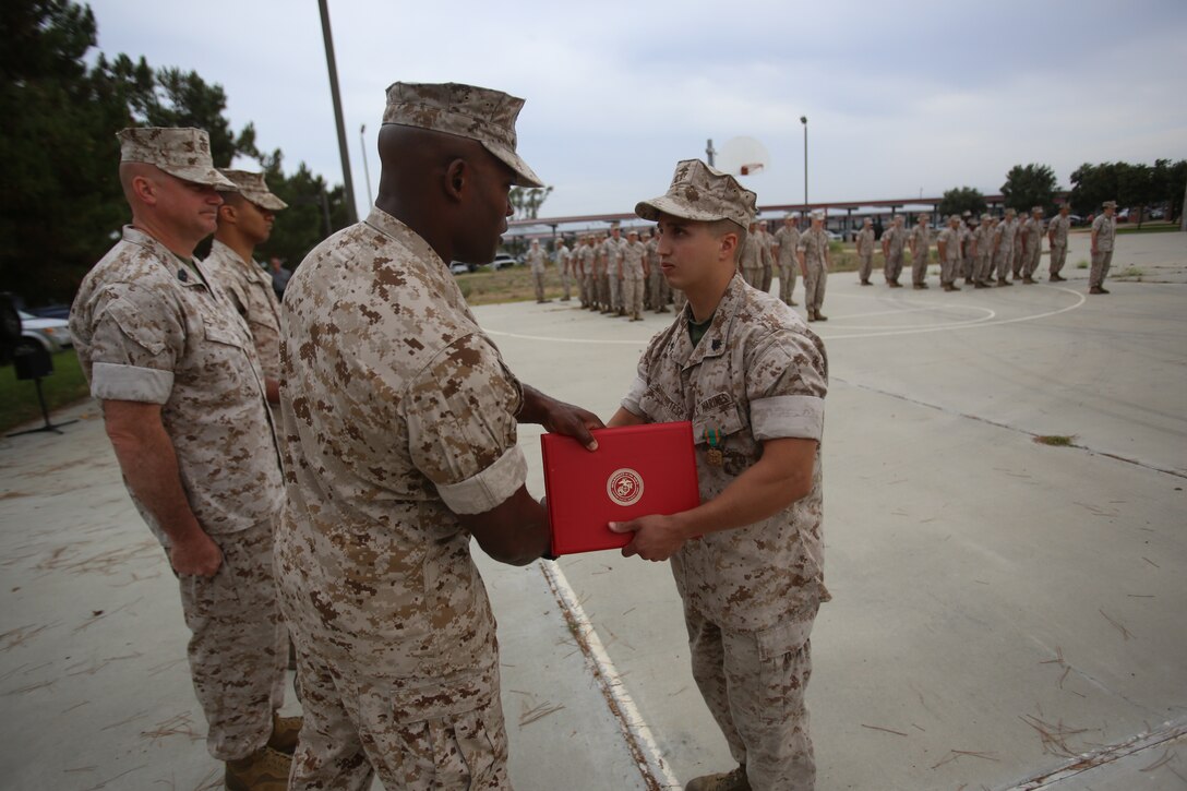 Marines with the 13th Marine Expeditionary Unit are presented with awards and promoted aboard Marine Corps Base Camp Pendleton, Calif., July 1, 2015. While some Marines are awarded for their expertise in their field and creative ideas, while others were promoted receiving even greater responsibilities.(U.S. Marine Corps photo by Lance Cpl. Alvin Pujols/Released) 