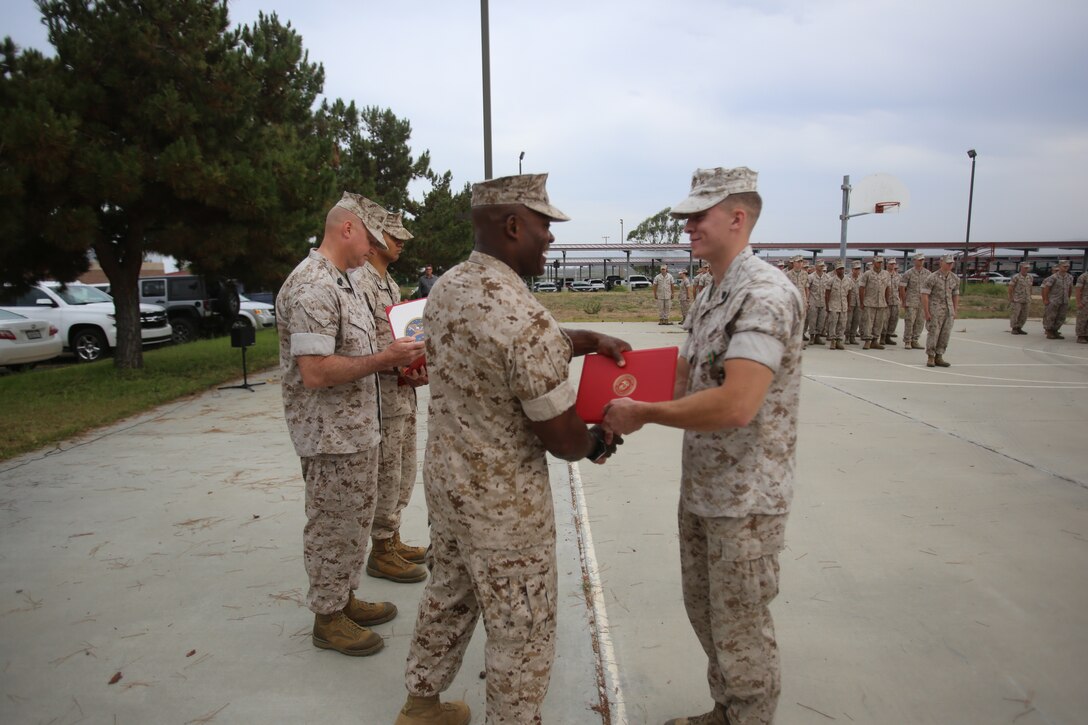 Marines with the 13th Marine Expeditionary Unit are presented with awards and promoted aboard Marine Corps Base Camp Pendleton, Calif., July 1, 2015. While some Marines are awarded for their expertise in their field and creative ideas, while others were promoted receiving even greater responsibilities.(U.S. Marine Corps photo by Lance Cpl. Alvin Pujols/Released) 