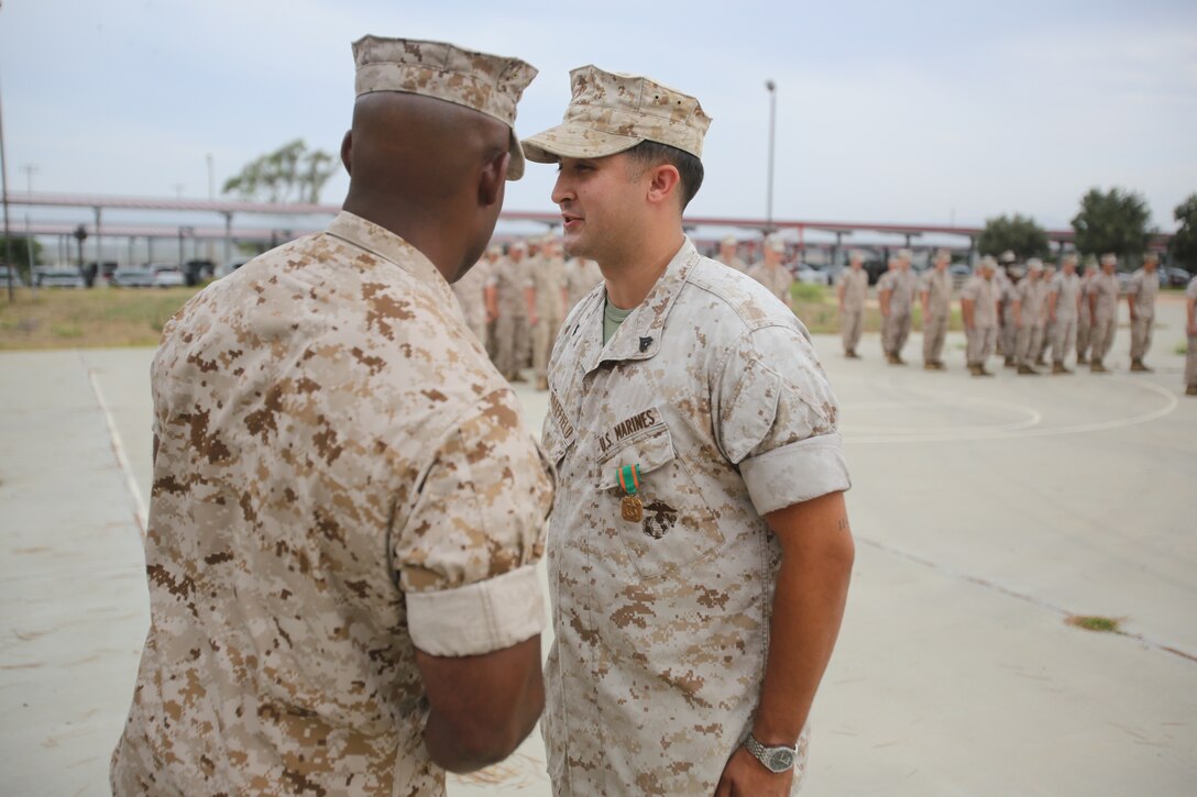 Marines with the 13th Marine Expeditionary Unit are presented with awards and promoted aboard Marine Corps Base Camp Pendleton, Calif., July 1, 2015. While some Marines are awarded for their expertise in their field and creative ideas, while others were promoted receiving even greater responsibilities.(U.S. Marine Corps photo by Lance Cpl. Alvin Pujols/Released) 