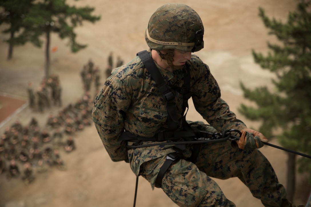 Cpl. Nicholas D. Ray, rifleman with Company G, 2nd Battalion, 24th Marine Regiment, 4th Marine Division, rappels down a tower during Peninsula Express 15-8 at the Mountain Warfare School in Pohang, Republic of Korea, June 30, 2015. At the school, Marines worked on their proficiencies in rappelling, fast roping and climbing in order to improve their ability to fight in mountainous environments. This is also the first time Marine Forces Reserve has participated in the Korean-Marine Exchange Program, a series of exercises between the U.S and Korean Marine Corps designed to build interoperability and tactical familiarity between partner nations.  