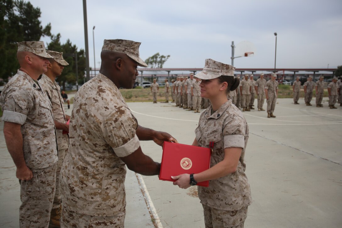Marines with the 13th Marine Expeditionary Unit are presented with awards and promoted aboard Marine Corps Base Camp Pendleton, Calif., July 1, 2015. While some Marines are awarded for their expertise in their field and creative ideas, while others were promoted receiving even greater responsibilities.(U.S. Marine Corps photo by Lance Cpl. Alvin Pujols/Released) 