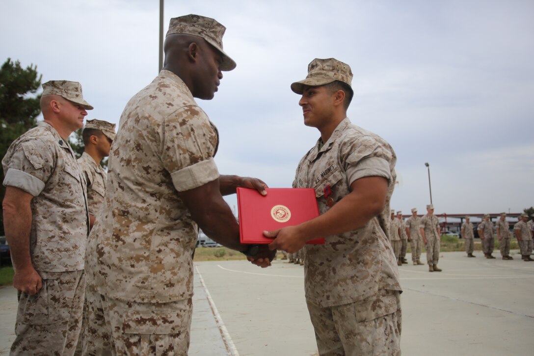 Marines with the 13th Marine Expeditionary Unit are presented with awards and promoted aboard Marine Corps Base Camp Pendleton, Calif., July 1, 2015. While some Marines are awarded for their expertise in their field and creative ideas, while others were promoted receiving even greater responsibilities.(U.S. Marine Corps photo by Lance Cpl. Alvin Pujols/Released) 