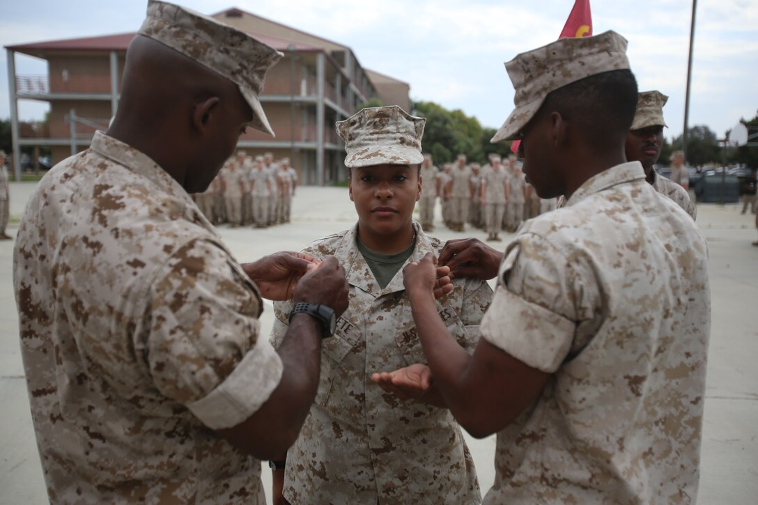 Marines with the 13th Marine Expeditionary Unit are presented with awards and promoted aboard Marine Corps Base Camp Pendleton, Calif., July 1, 2015. While some Marines are awarded for their expertise in their field and creative ideas, while others were promoted receiving even greater responsibilities.(U.S. Marine Corps photo by Lance Cpl. Alvin Pujols/Released) 