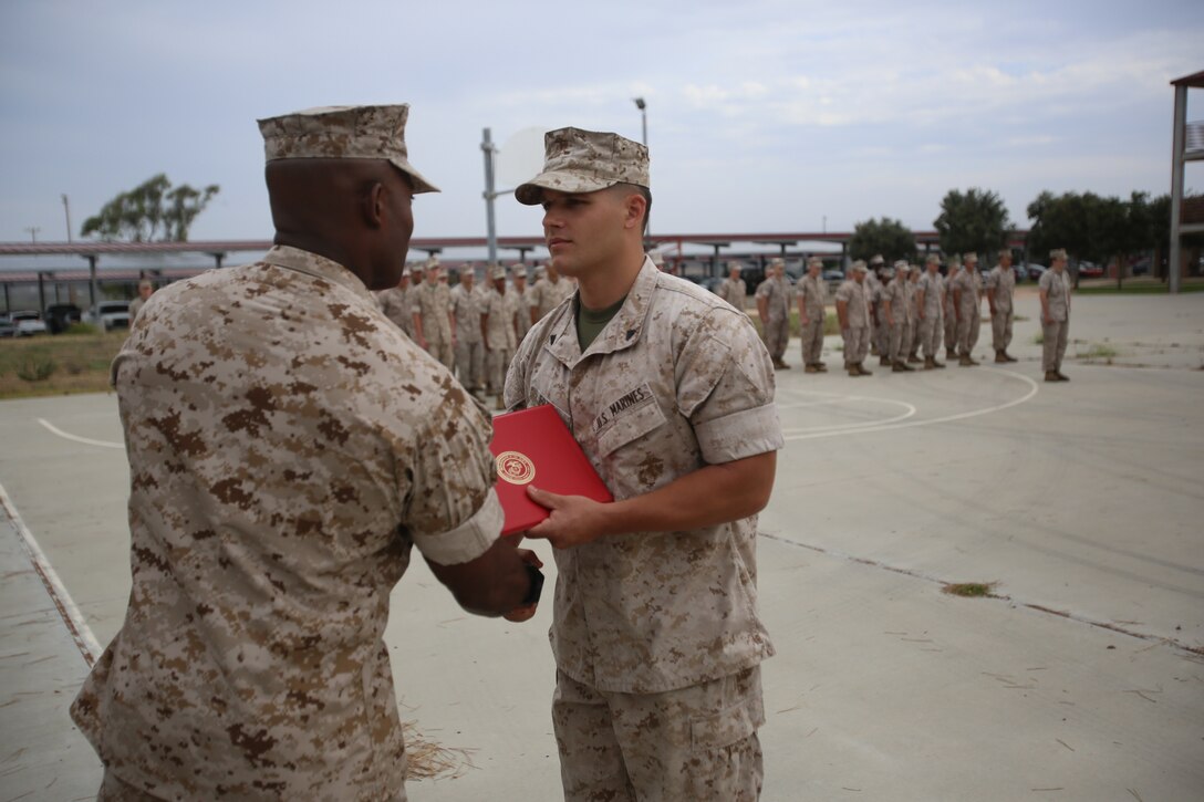 Marines with the 13th Marine Expeditionary Unit are presented with awards and promoted aboard Marine Corps Base Camp Pendleton, Calif., July 1, 2015. While some Marines are awarded for their expertise in their field and creative ideas, while others were promoted receiving even greater responsibilities.(U.S. Marine Corps photo by Lance Cpl. Alvin Pujols/Released) 