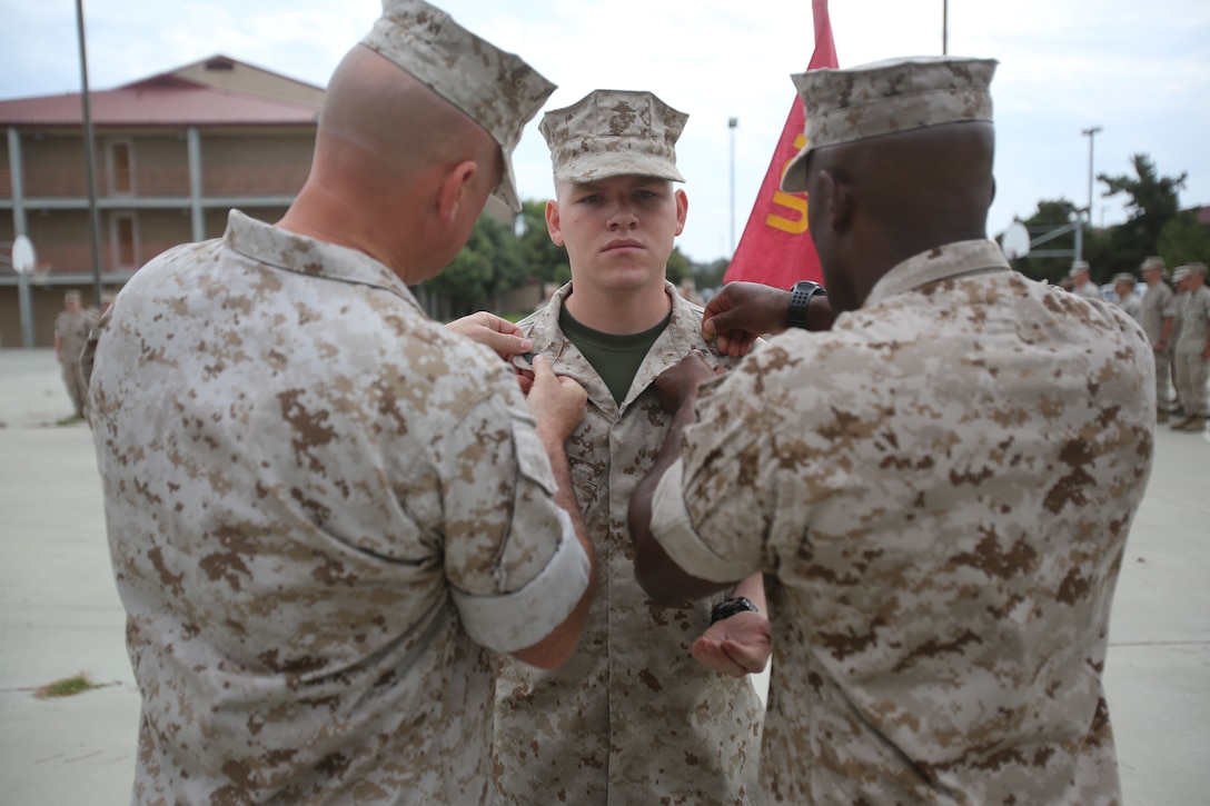 Marines with the 13th Marine Expeditionary Unit are presented with awards and promoted aboard Marine Corps Base Camp Pendleton, Calif., July 1, 2015. While some Marines are awarded for their expertise in their field and creative ideas, while others were promoted receiving even greater responsibilities.(U.S. Marine Corps photo by Lance Cpl. Alvin Pujols/Released) 
