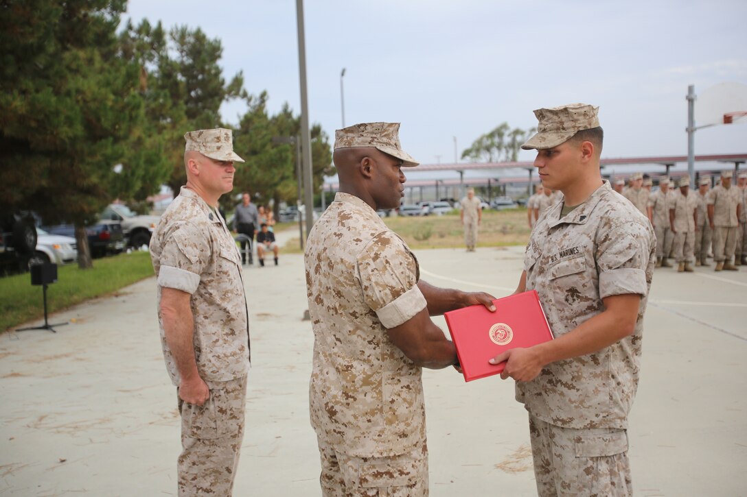 Marines with the 13th Marine Expeditionary Unit are presented with awards and promoted aboard Marine Corps Base Camp Pendleton, Calif., July 1, 2015. While some Marines are awarded for their expertise in their field and creative ideas, while others were promoted receiving even greater responsibilities.(U.S. Marine Corps photo by Lance Cpl. Alvin Pujols/Released)
