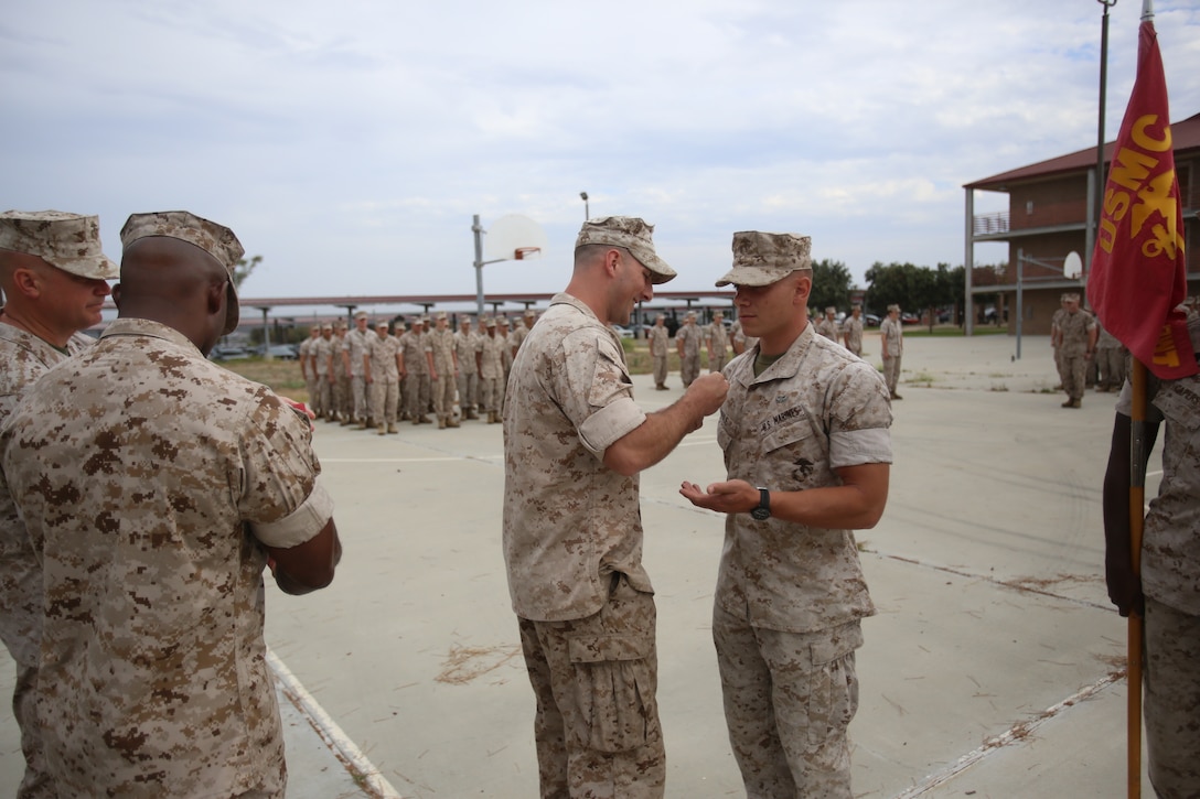 Marines with the 13th Marine Expeditionary Unit are presented with awards and promoted aboard Marine Corps Base Camp Pendleton, Calif., July 1, 2015. While some Marines are awarded for their expertise in their field and creative ideas, while others were promoted receiving even greater responsibilities.(U.S. Marine Corps photo by Lance Cpl. Alvin Pujols/Released) 