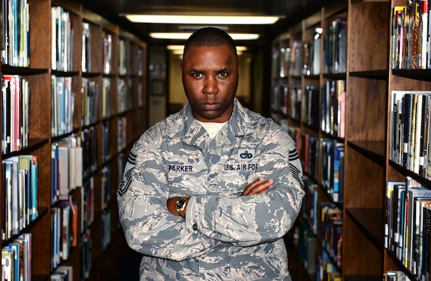 U.S. Air Force Chief Master Sgt. Marvin Parker, 36th Mission Support Group superintendent, holds a doctorate in business administration, summa cum laude. Since completing his transportation management Community College of the Air Force degree in 2003, Parker hasn’t stop pursuing higher education and hopes to motivate other Airmen to follow his example. (U.S. Air Force photo by Senior Airman Alexander W. Riedel/Released)