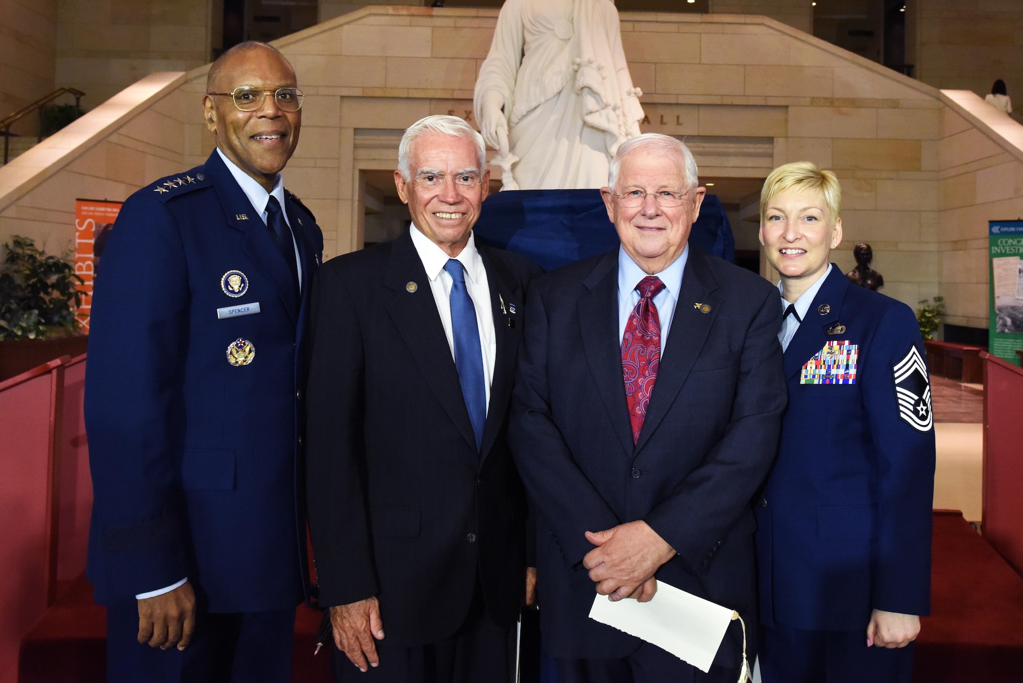 Air Force Vice Chief of Staff Gen. Larry O. Spencer, retired Air Force Col. Michael Brazelton, retired Air Force Col. William Driggers Jr., and the executive assistant to the chief master sergeant of the Air Force, Chief Master Sgt. Nicole Johnson, pose for photo in the Emancipation Hall of the U.S. Capitol Building in Washington, July 8, 2015, after the Congressional Commemoration of the 50th Anniversary of the Vietnam War. (U.S. Air Force photo/Staff Sgt. Carlin Leslie)