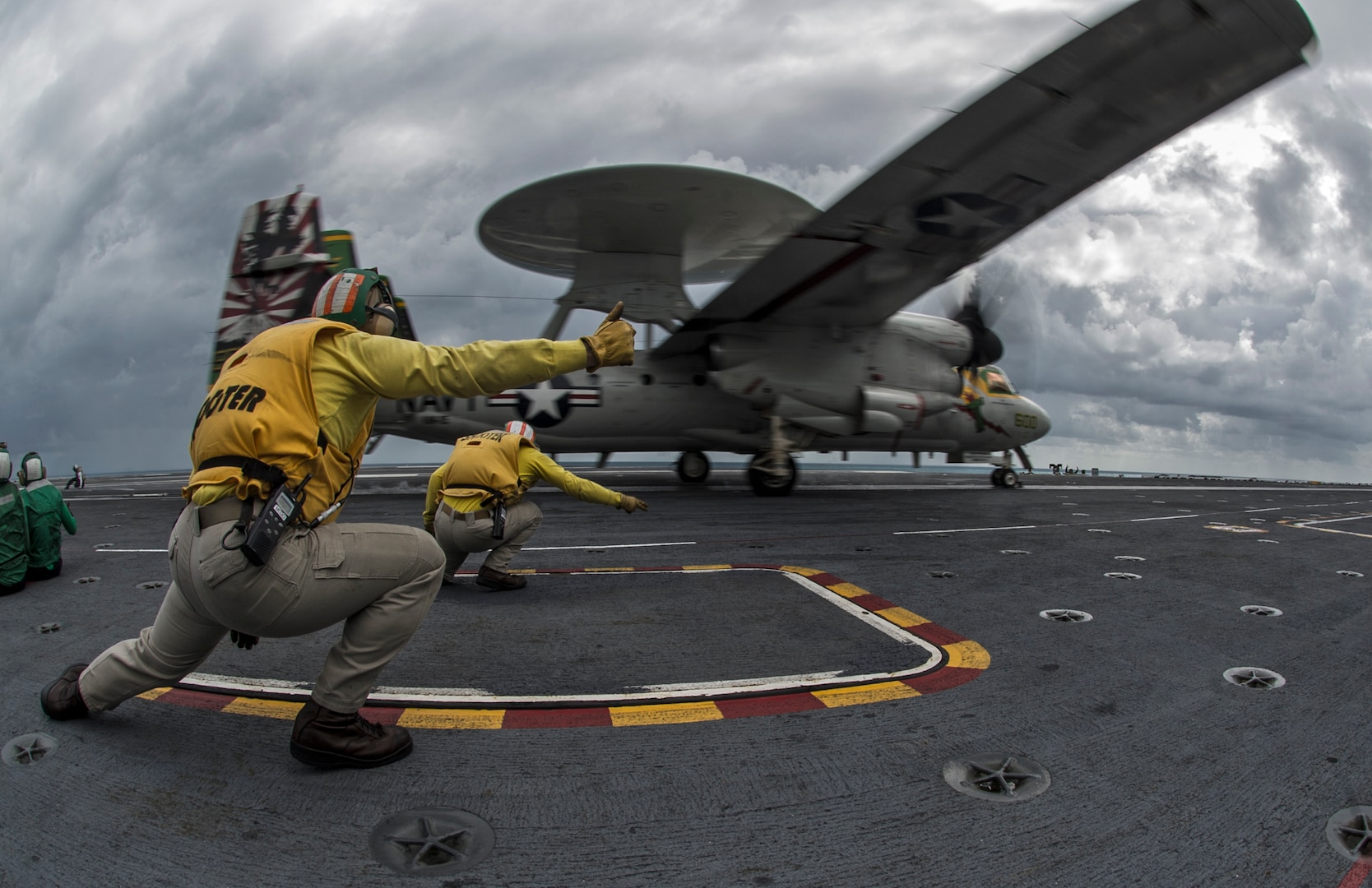 150709-N-IP531-028 TIMOR SEA (July 9, 2015) Lt. Morgan George, front, and Lt. Kieth Ferrell, shooters aboard the Nimitz-class aircraft carrier USS George Washington (CVN 73), launch an E-2C Hawkeye from the Liberty Bells of Airborne Early Warning Squadron (VAW) 115 during Talisman Sabre 2015. Talisman Sabre is a biennial exercise that provides an invaluable opportunity for nearly 30,000 U.S. and Australian defense forces to conduct operations in a combined, joint and interagency environment that will increase both countries' ability to plan and execute a full range of operations from combat missions to humanitarian assistance efforts. (U.S. Navy photo by Mass Communication Specialist 3rd Class Chris Cavagnaro/Released)