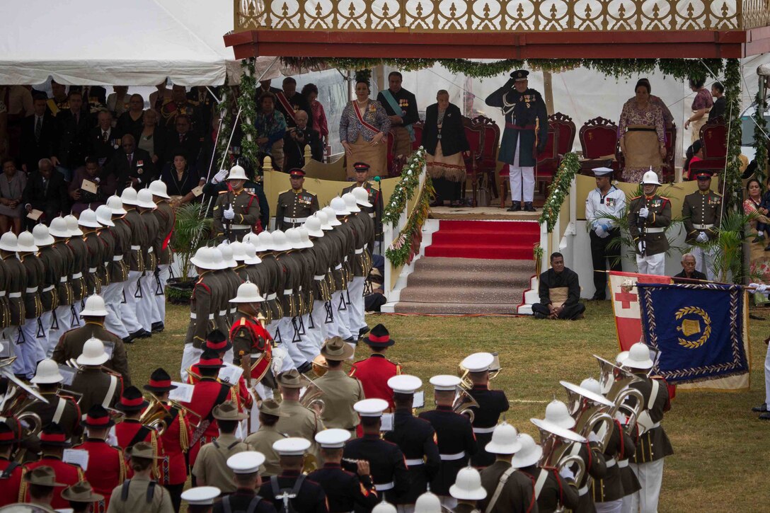 King Tupou VI salutes troops as they pass during his coronation celebration in Nuku'alofa, Tonga, July 6, 2015. After participating in the King’s Birthday Celebration and military tattoo in 2011, the U.S. Marine Corps Forces, Pacific Band accepted the invitation to participate in the Coronation events, honoring the King of Tonga and His Majesty’s Armed Forces.