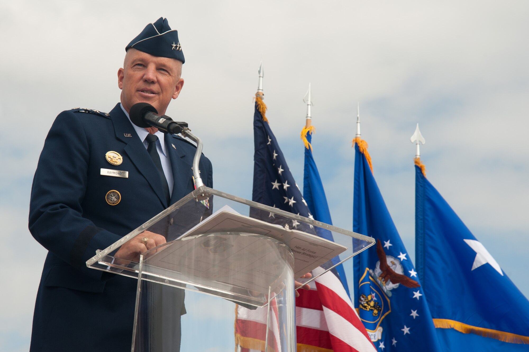 Lt. Gen. John W. “Jay” Raymond, commander, 14th Air Force (Air Forces Strategic) and Joint Functional Component Command for Space, speaks to a crowd of Vandenberg Airmen and guests during the 30th Space Wing change of command ceremony July 9, 2015, Vandenberg Air Force Base, Calif. (U.S. Air Force photo by Michael Peterson/Released)