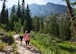 Airman 1st Class Alexis Visser, 90th Munitions Squadron, and Senior Airman Rachel Silverberg, 90th Force Support Squadron, hike the Hidden Falls trail in Grand Teton National Park, Wyo., July 3, 2015. Visser and Silverberg were participants of an F.E. Warren Air Force Base Outdoor Recreation trip that explored the natural attractions of Grand Teton and Yellowstone National Park during the July 4th weekend. (U.S. Air Force photo by Lan Kim)