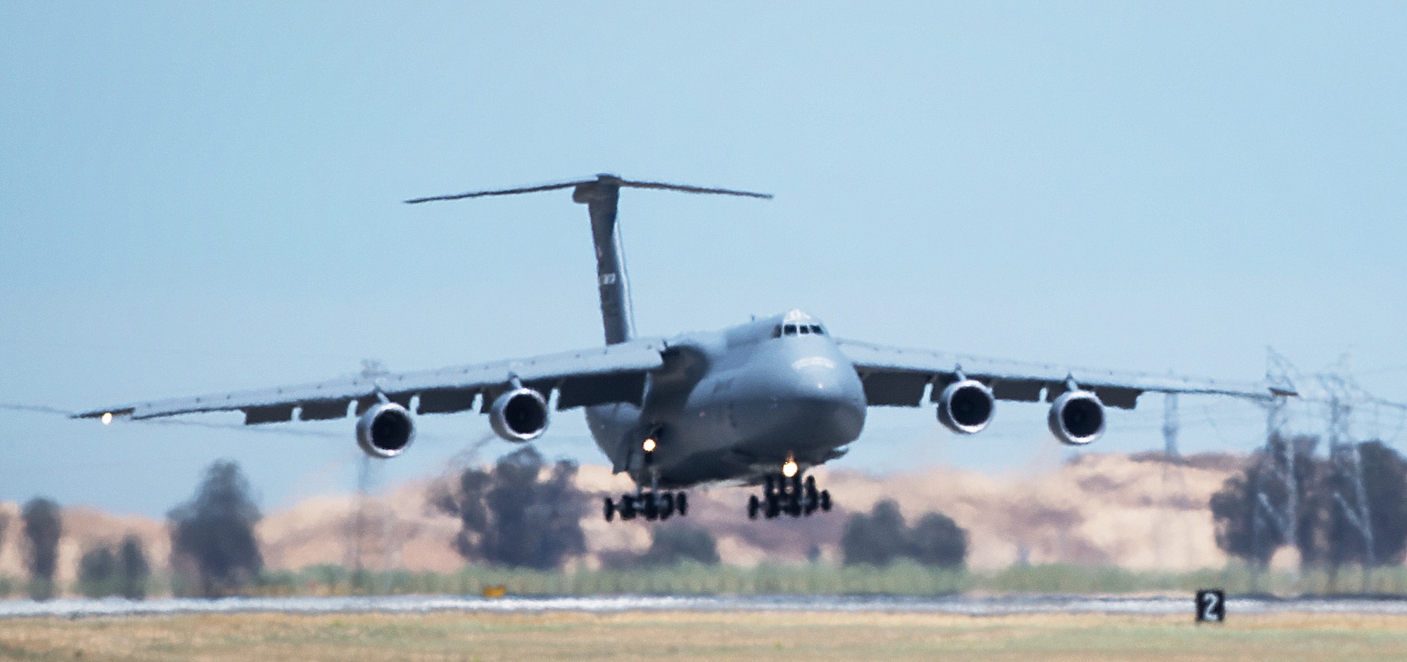 Delivery of a newly refurbished C-5M Super Galaxy arrives at Travis Air Force Base, California, July 8, 2015. The newly-modernized aircraft is the seventh C-5M to return to Travis following retrograde and refurbishment. The C-5M Super Galaxy incorporates more than 70 aircraft improvements, including new GE CF6-80C2 engines that support a 22 percent increase in thrust, 55 percent greater climb rate, tenfold increase in engine reliability and Stage 4 noise and emission compliance. (U.S. Air Force photo by Ken Wright)