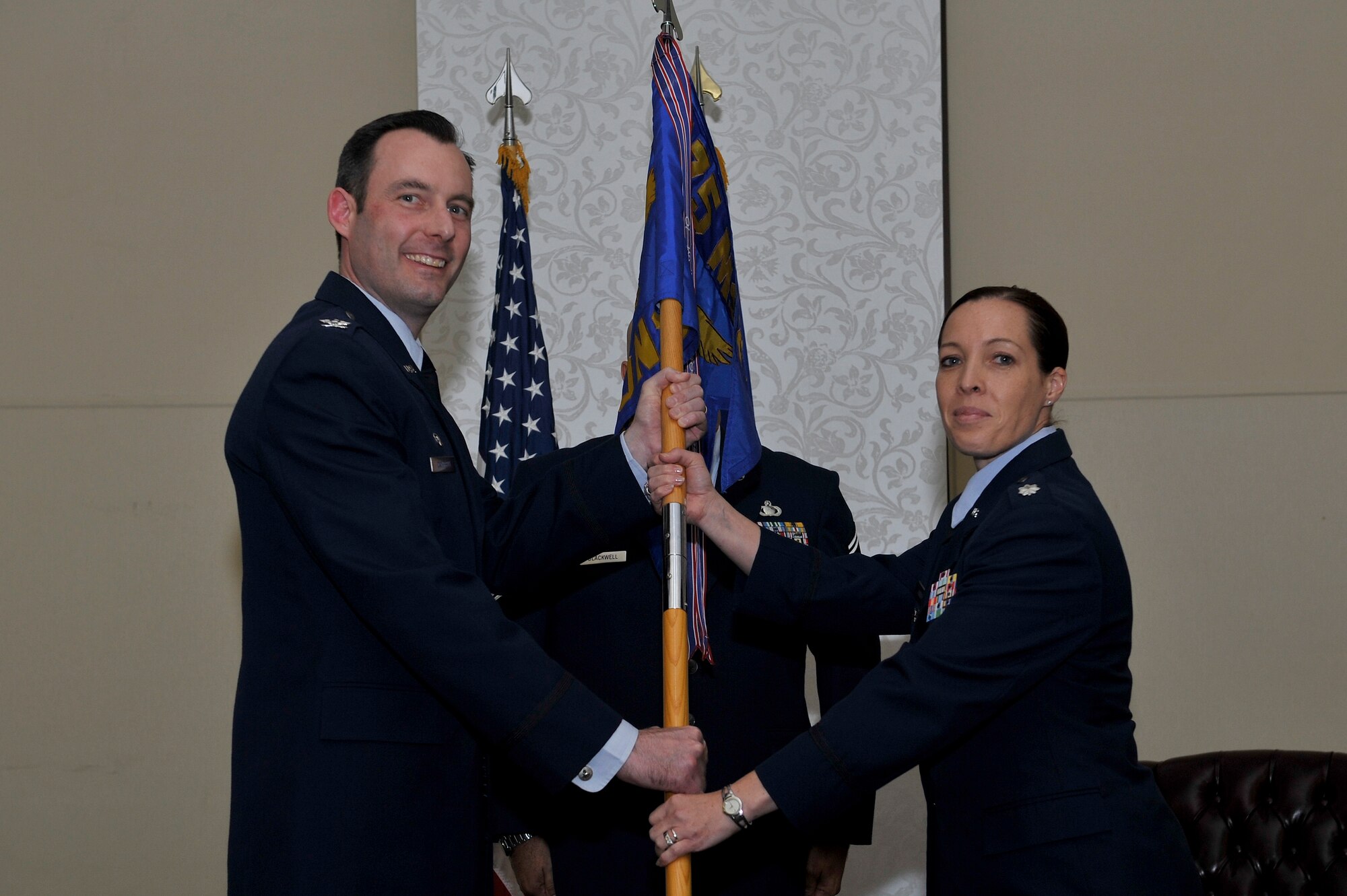 Lt. Col. Annette Harvey receives the 375th Mission Support Group guideon from Col. Shawn Campbell June 29 at Scott. She assumed command of the 375th Contracting Squadron. Campbell is the 375th Mission Support Group Commander. (U.S. Air Force photo by Senior Airman Sarah Hall-Kirchner)