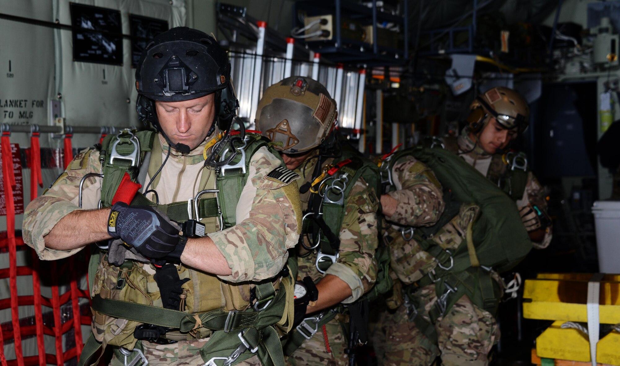 A pararescueman with the 320th Special Tactics Squadron checks his altimeter prior to jumping out of an MC-130J Commando II from the 17th Special Operations Squadron near Kuantan, Malaysia, June 8, 2015. The High-Altitude Low-Opening jumps were conducted as part of Exercise Teak Mint, a multinational and bilateral exercise between the Royal Malaysian Air Force and the U.S. Air Force. (U.S. Air Force photo by Tech. Sgt. Kristine Dreyer) 