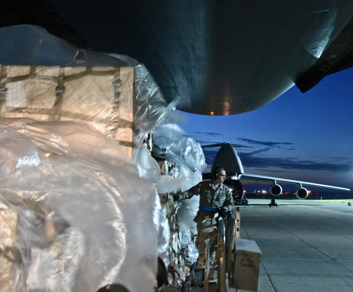 Airman 1st Class Nicholas Knorr, 60th Aerial Port Squadron ramp operations journeyman, applies his expeditor skills July 7 at Travis Air Force Base, California. Knorr, one of seven students, participated in the Aerial Port Expeditor Course from June 22 to July 10. (U.S. Air Force photo by Airman 1st Class Amber Carter)