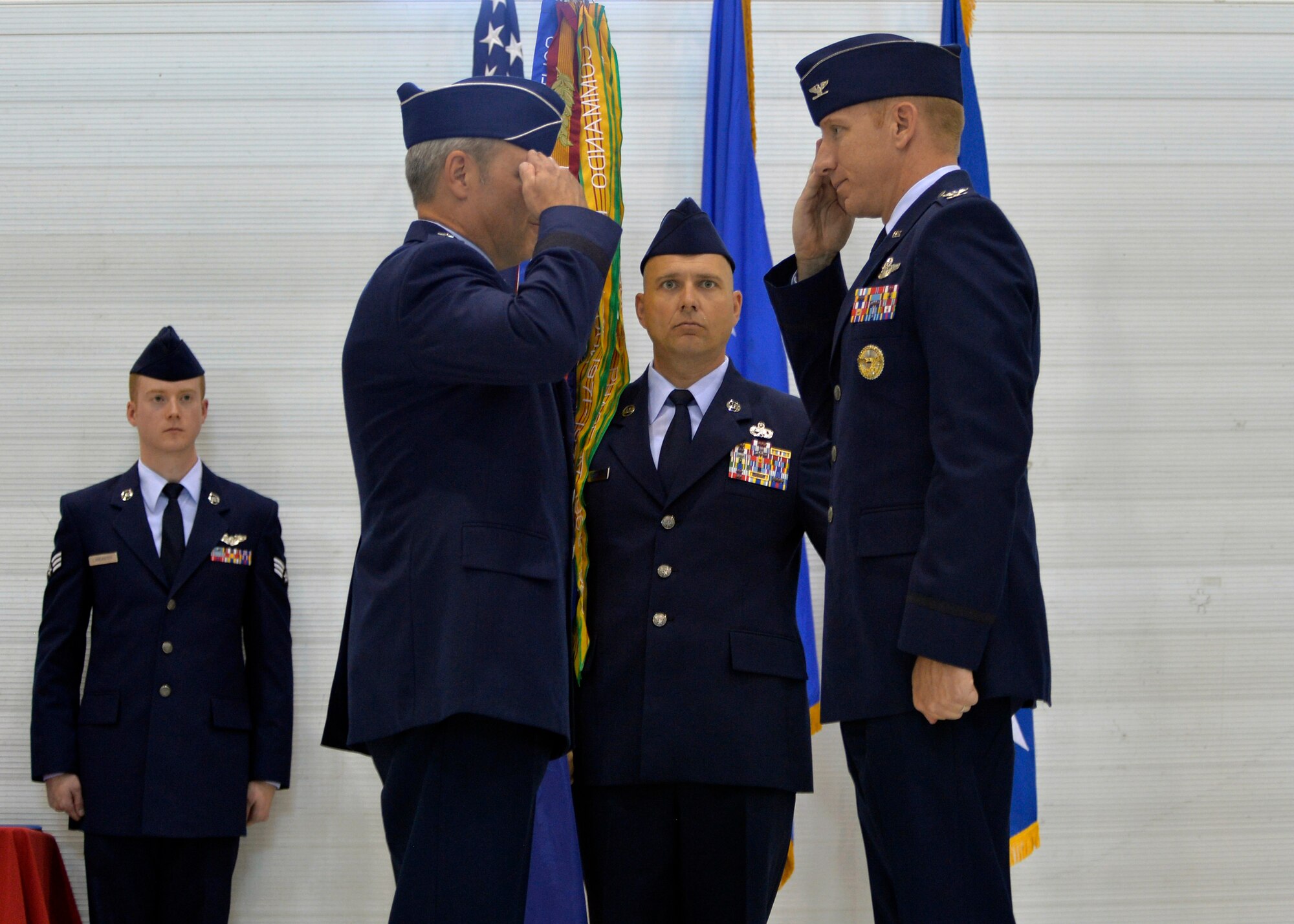 Col. Case Cunningham, 432nd Wing commander, salutes Lt. Gen. Chris Noland, 12th Air Force commander, after taking command during a change of command ceremony held on June 29, 2015 at Creech Air Force Base, Nevada. The ceremony is a military tradition that represents a formal transfer of authority and responsibility for a unit from one commanding officer to another. (U.S. Air Force photo by Airman 1st Class Christian Clausen/Released)