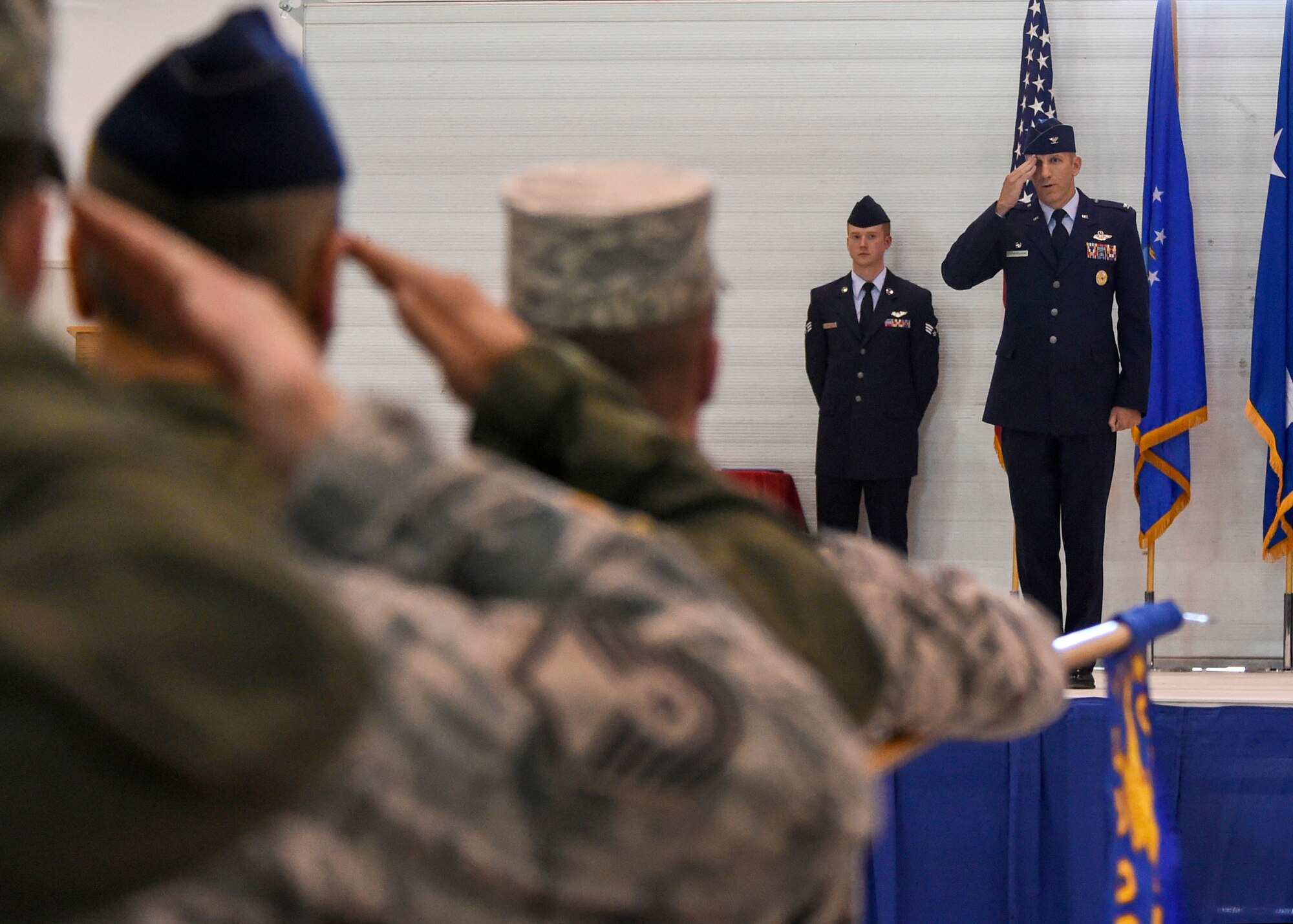 Col. Case Cunningham, 432nd Wing commander, receives his first salute from Airman under his command during a change of command ceremony held on June 29, 2015 at Creech Air Force Base, Nevada. The ceremony is a military tradition dating back to the times of the Roman Legion. (U.S. Air Force photo by Tech. Sgt. Shad Eidson/Released)