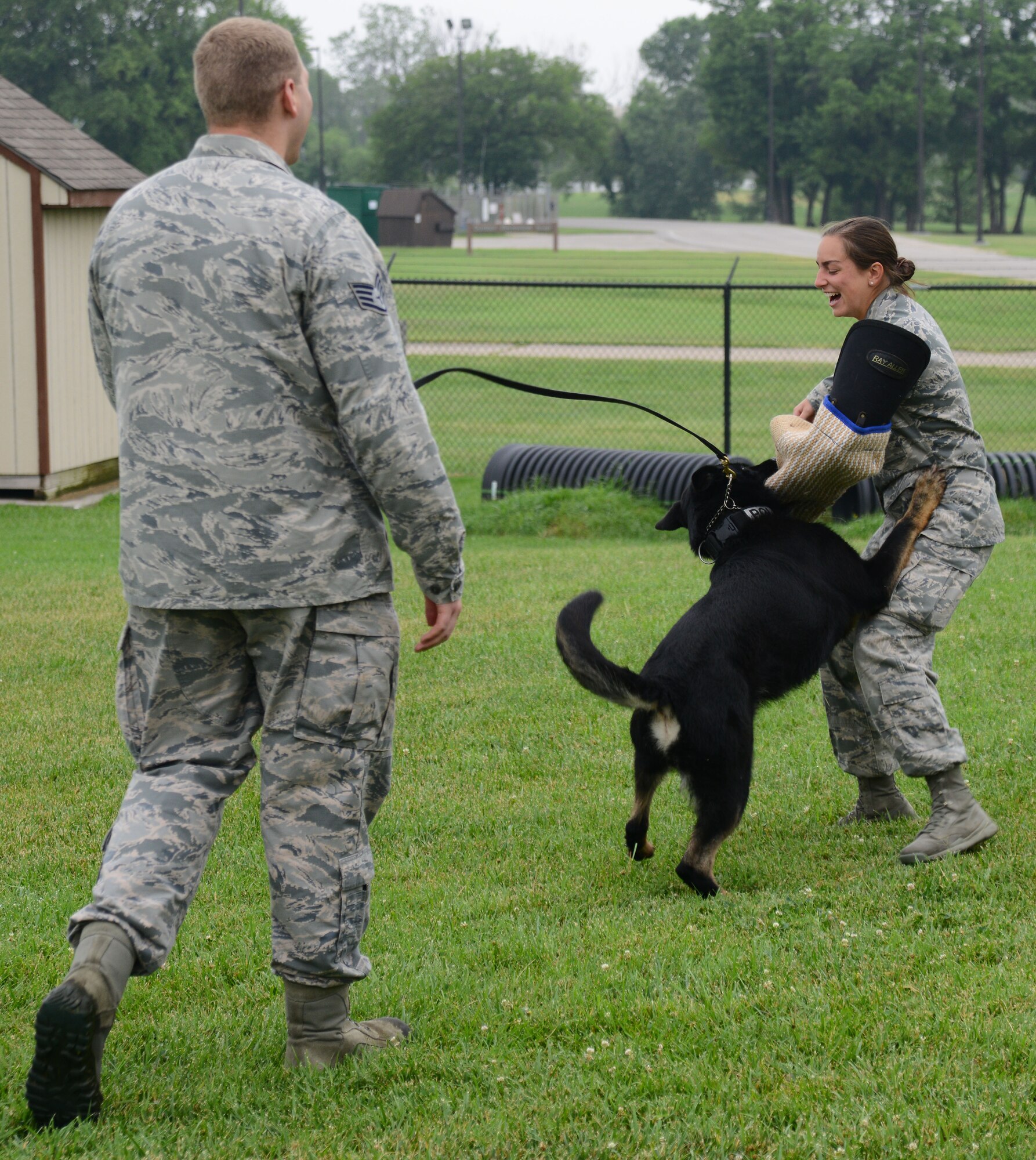 U.S. Air Force Academy cadets visit the 22nd Security Forces Squadron Military Working Dogs and their handlers, July 8, 2015, at McConnell Air Force Base, Kan. The cadets met with handlers, asked questions and watched a demonstration to explore the career field of a SFS officer. (U.S. Air Force photos by Airman 1st Class Christopher Thornbury)