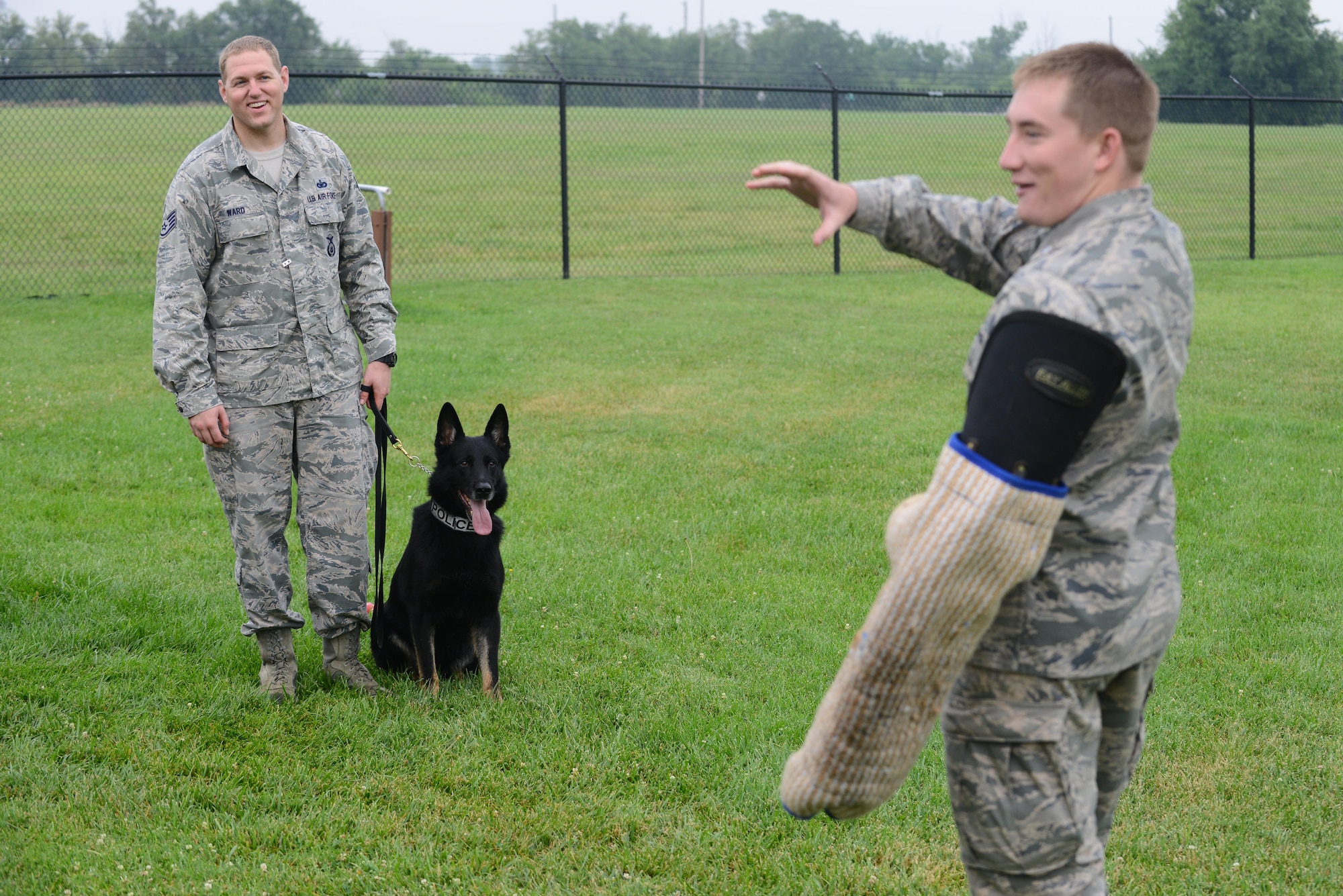 U.S. Air Force Academy cadets visit the 22nd Security Forces Squadron Military Working Dogs and their handlers, July 8, 2015, at McConnell Air Force Base, Kan. The cadets met with handlers, asked questions and watched a demonstration to explore the career field of a SFS officer. (U.S. Air Force photos by Airman 1st Class Christopher Thornbury)