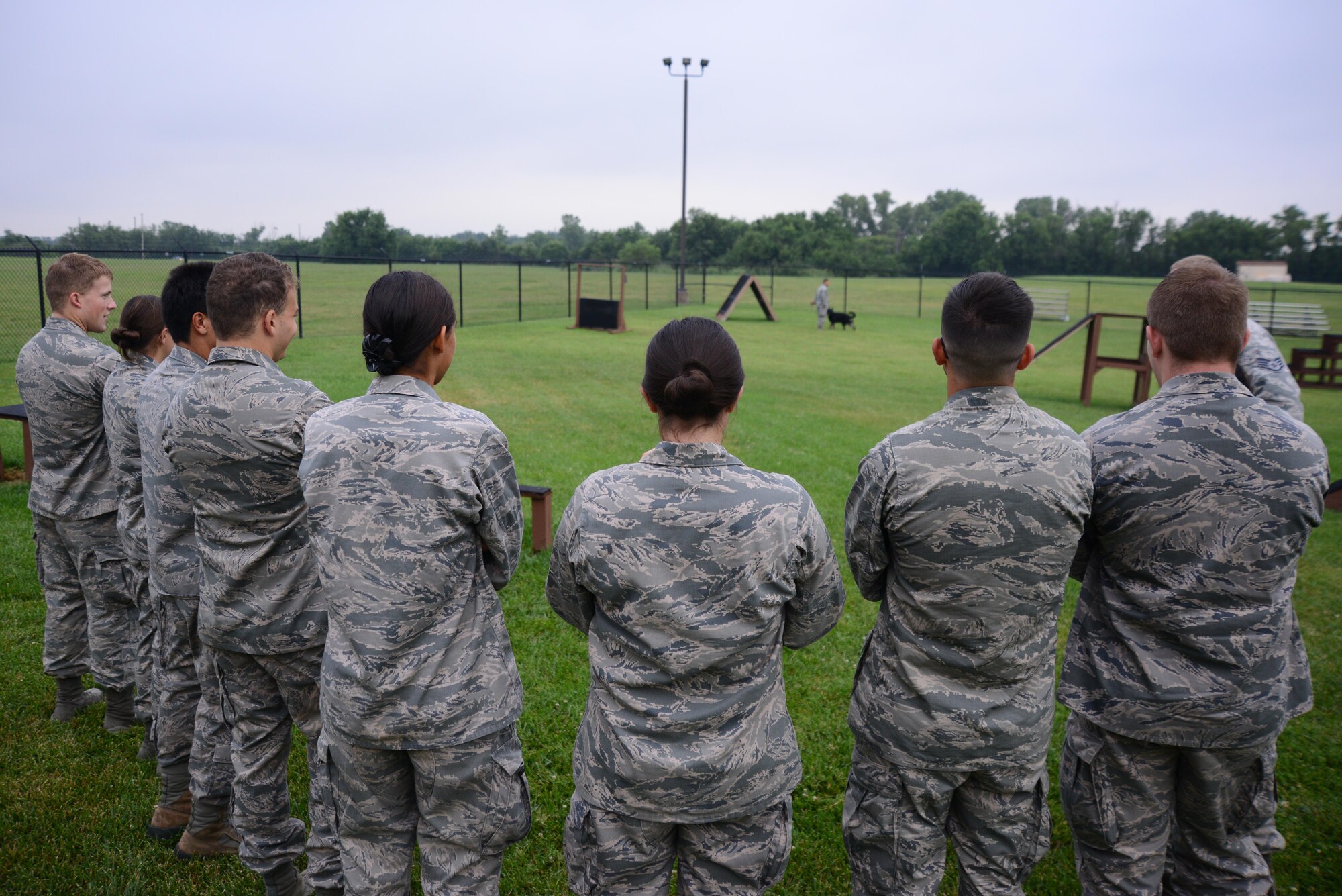 U.S. Air Force Academy cadets visit the 22nd Security Forces Squadron Military Working Dogs and their handlers, July 8, 2015, at McConnell Air Force Base, Kan. The cadets met with handlers, asked questions and watched a demonstration to explore the career field of a SFS officer. (U.S. Air Force photos by Airman 1st Class Christopher Thornbury)