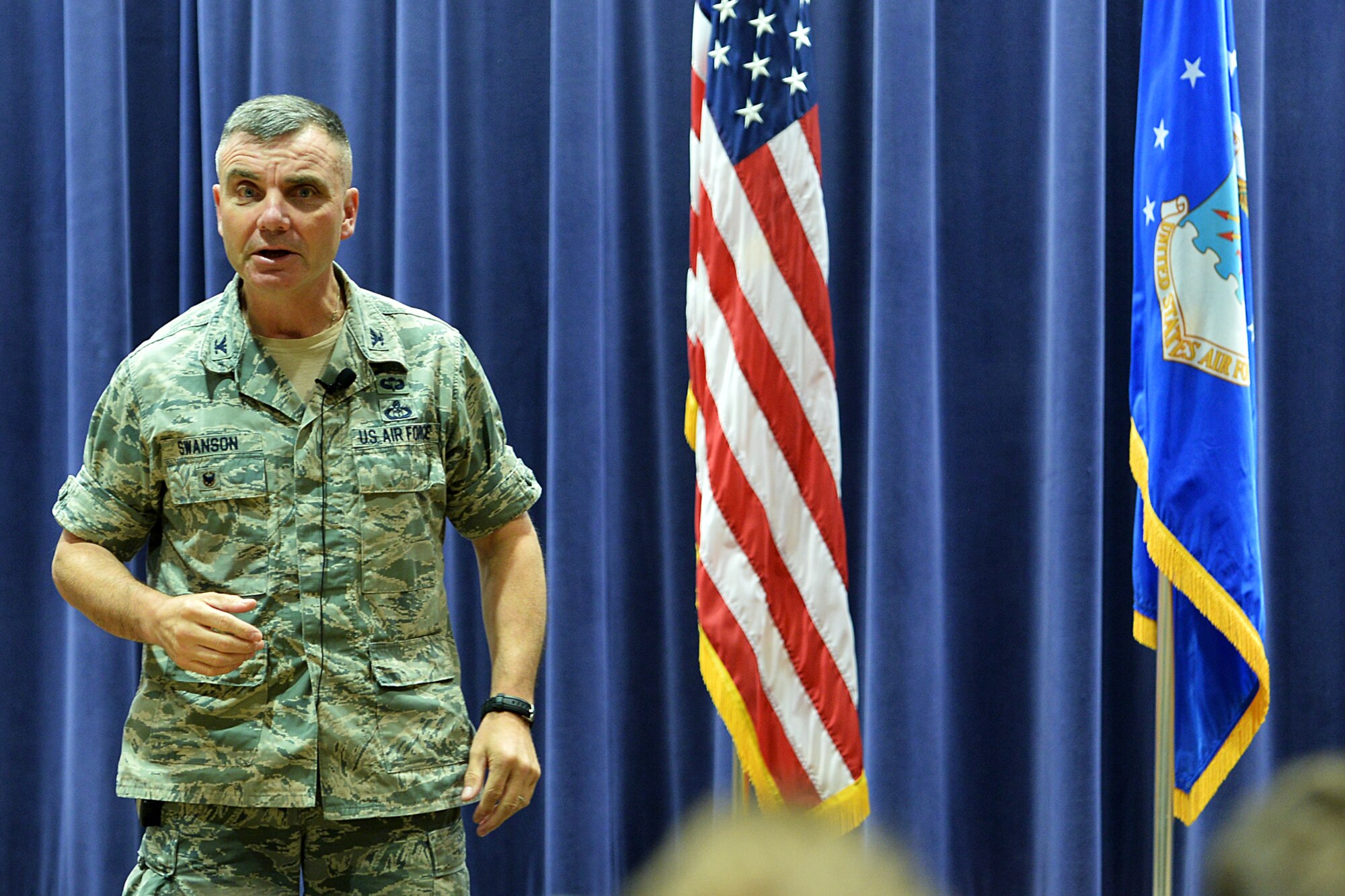 U.S. Air Force Col. Robert Swanson, strategic plans and interagency integration office chief at the Pentagon, speaks to Team Offutt members during a suicide prevention brief inside the 557th Weather Wing headquarters building on Offutt AFB, Neb., July 7. Swanson gives personal testimony of how he overcame his struggles after his suicide attempts and provides listeners with ways that they can help themselves in moments of crisis. (Photo by Charles Haymond)