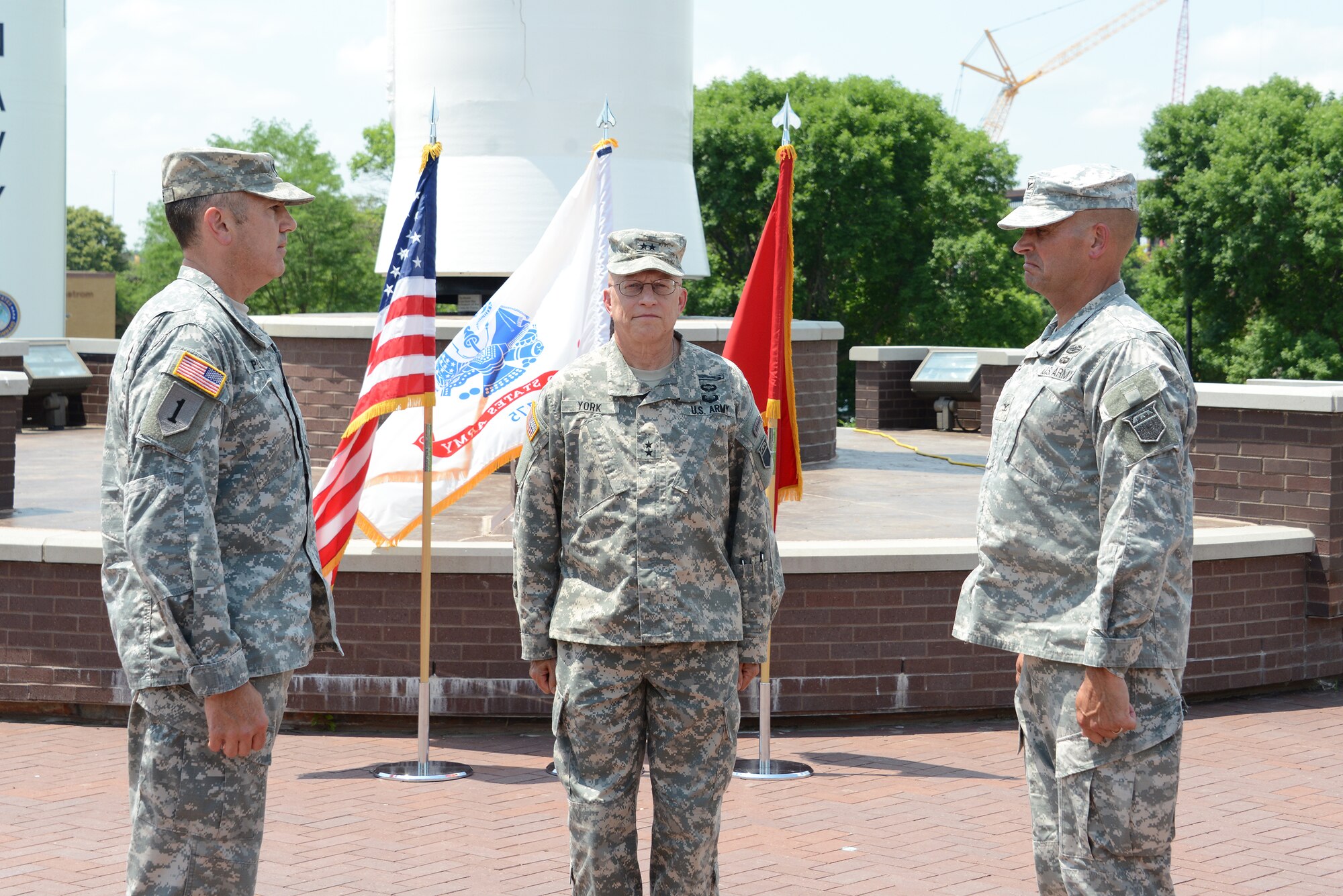 U.S. Army Maj. Gen. Daniel L. York (center), 76th Operational Response Command commander, U.S. Army Col. Jeffery M. Ruchie (right) and U.S. Army Lt. Col. Michael D. Poss participate in the USSTRATCOM Army Reserve Element change of command ceremony, Offutt Air Force Base, Neb., July 1, 2015. During the ceremony Ruchie assumed command of the ARE from Poss. The ARE provides highly-trained and mission-ready Army Reserve Soldiers to support the full spectrum of global operations conducted by USSTRATCOM. USSTRATCOM is one of nine DOD unified combatant commands and is charged with strategic deterrence; space operations; cyberspace operations; joint electronic warfare; global strike; missile defense; intelligence, surveillance and reconnaissance; combating weapons of mass destruction; and analysis and targeting. (USSTRATCOM photo by U.S. Air Force Staff Sgt. Jonathan Lovelady/Released)