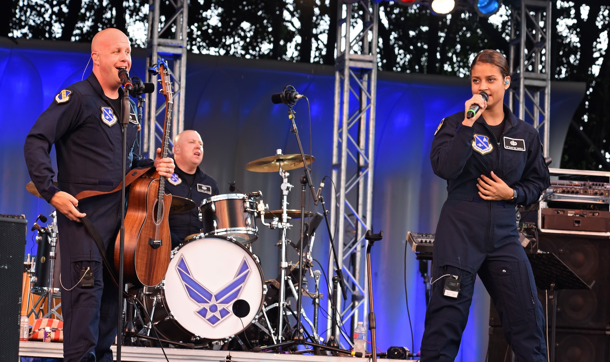 Senior Master Sgt. Ryan Carson on vocals, Technical Sgt. Robert Smith on drums and Technical Sgt. Nalani Quintello also on vocals, perform with Max Impact, the premier rock band of the United States Air Force at the National Sylvan Theater on the Fourth of July to celebrate Independence Day.  (U.S. Air Force Photo by MSgt Amaani Lyle/released)
