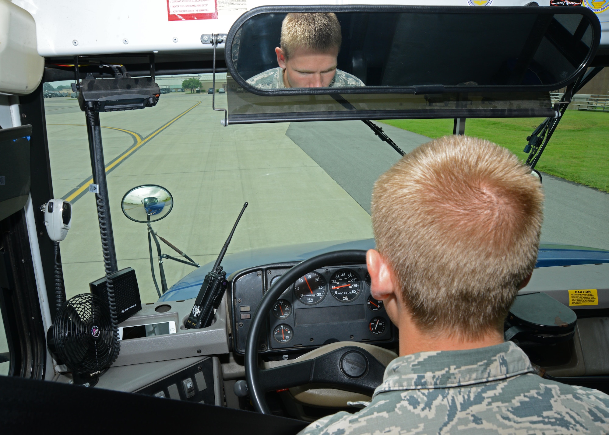 Airman 1st Class Weston Huffer, 22nd Logistics Readiness Squadron vehicle operator, drives a bus back to the squadron, July 7, 2015, McConnell Air Force Base, Kan. Vehicle operations Airmen transport aircrews to and from aircraft. (U.S. Air Force photo by Airman 1st Class Christopher Thornbury)