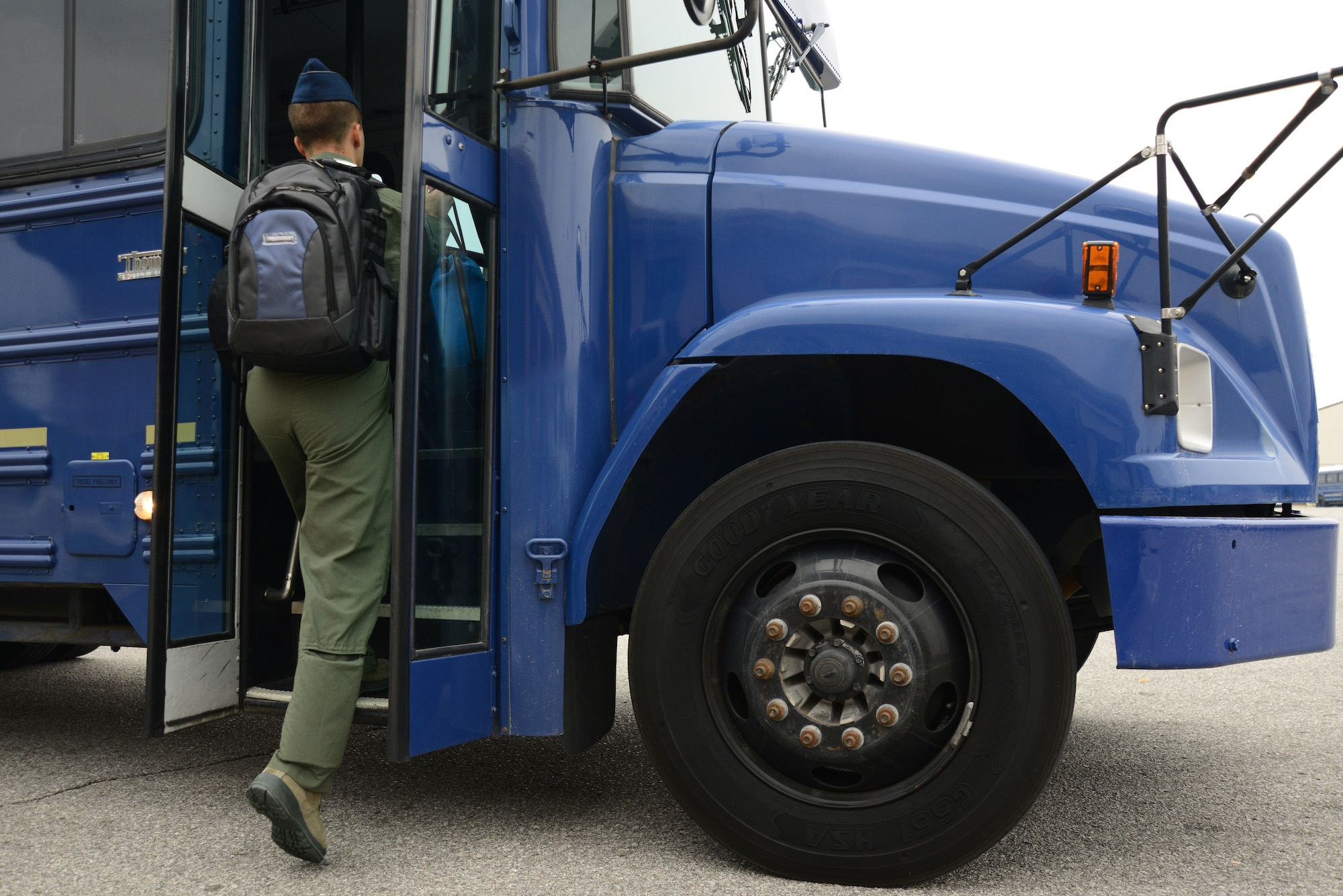 A KC-135 Stratotanker pilot boards a 22nd Logistics Readiness Squadron bus headed to to the flight line, July 7, 2015, McConnell Air Force Base, Kan. Vehicle operations Airmen transport Team McConnell members around base. (U.S. Air Force photo by Airman 1st Class Christopher Thornbury)