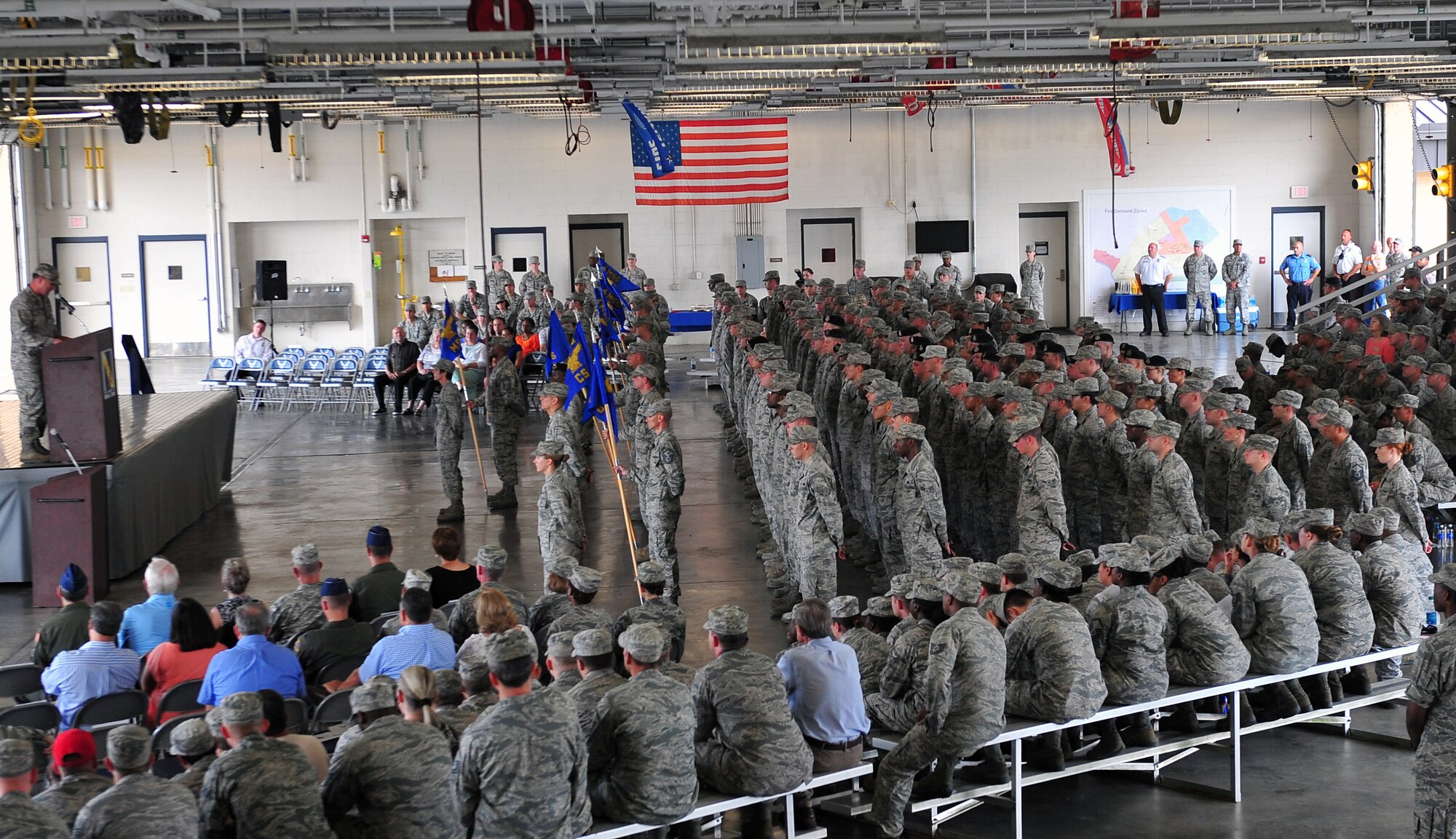 Attendees observe the 4th Mission Support Group assumption of command ceremony, July 8, 2015, at Seymour Johnson Air Force Base, North Carolina. The 4th MSG deploys, organizes, trains, and equips forces capable to deploy worldwide in support of combat forces. (U.S. Air Force photo/Senior Airman John Nieves Camacho)