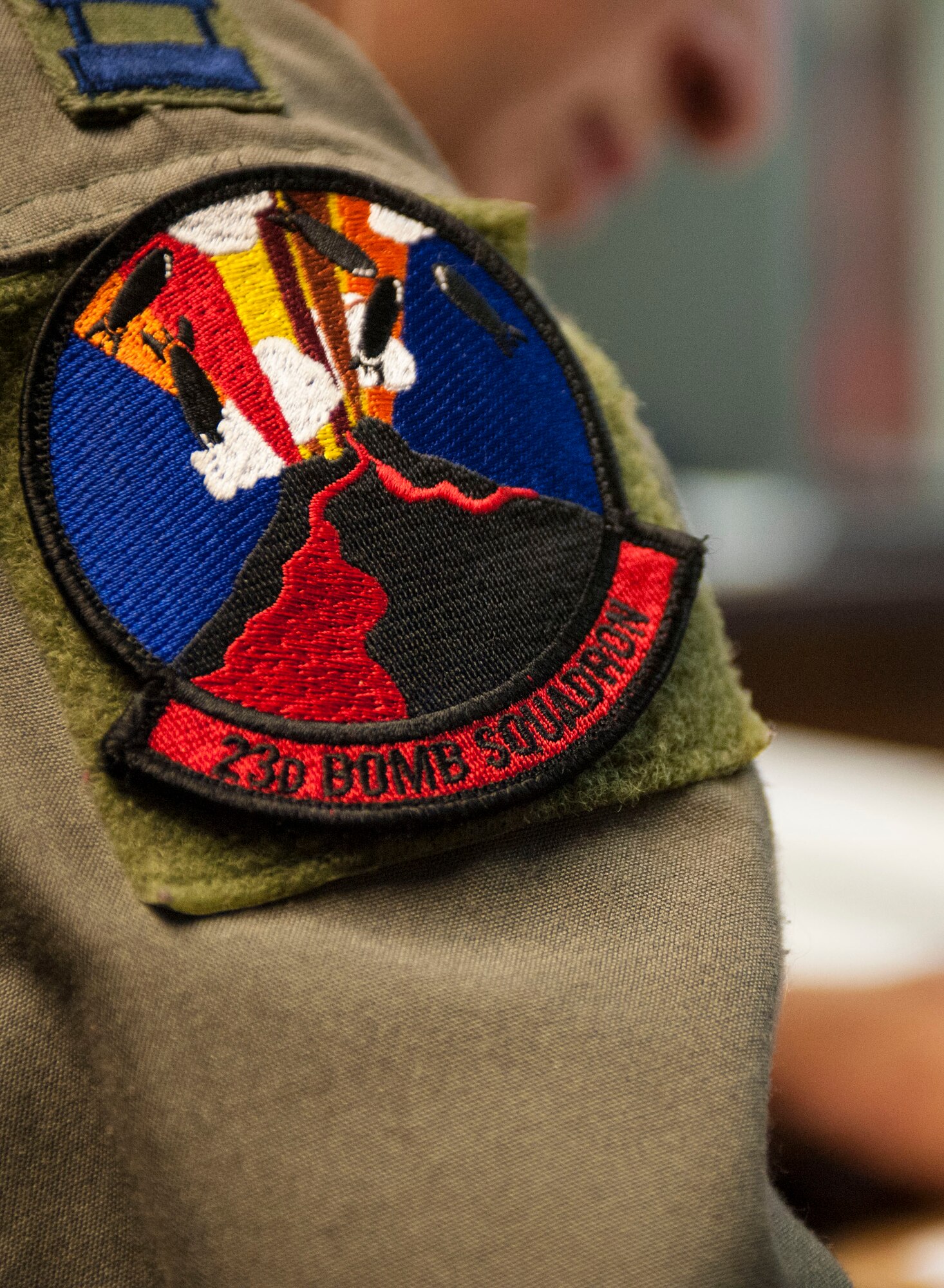 A 23rd Bomb Squadron patch adorns the shoulder of a B-52H Stratofortress
crew member at Minot Air Force Base, N.D., July 9, 2015. The patch's graphic
depicts a lava bombing mission that occurred December 27, 1935 in which the
23rd BS bombed a lava flow from the Mauna Loa volcano diverting it away from
the city of Hilo. (U.S. Air Force photo/Senior Airman Stephanie Morris)
