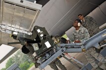 Senior Airman Jerome Ethridge, a 5th Aircraft Maintenance Squadron three man, operates the controls of a MHU-83 “Jammer” lift during the Load Crew of the Quarter competition at Minot Air Force Base, N.D., July 1, 2015. Of the Airmen that make up the load crew, the three man is tasked with maneuvering the MHU-83 lift as directed by the two man and load crew chief. (U.S. Air Force photo/ Airman 1st Class Justin T. Armstrong)